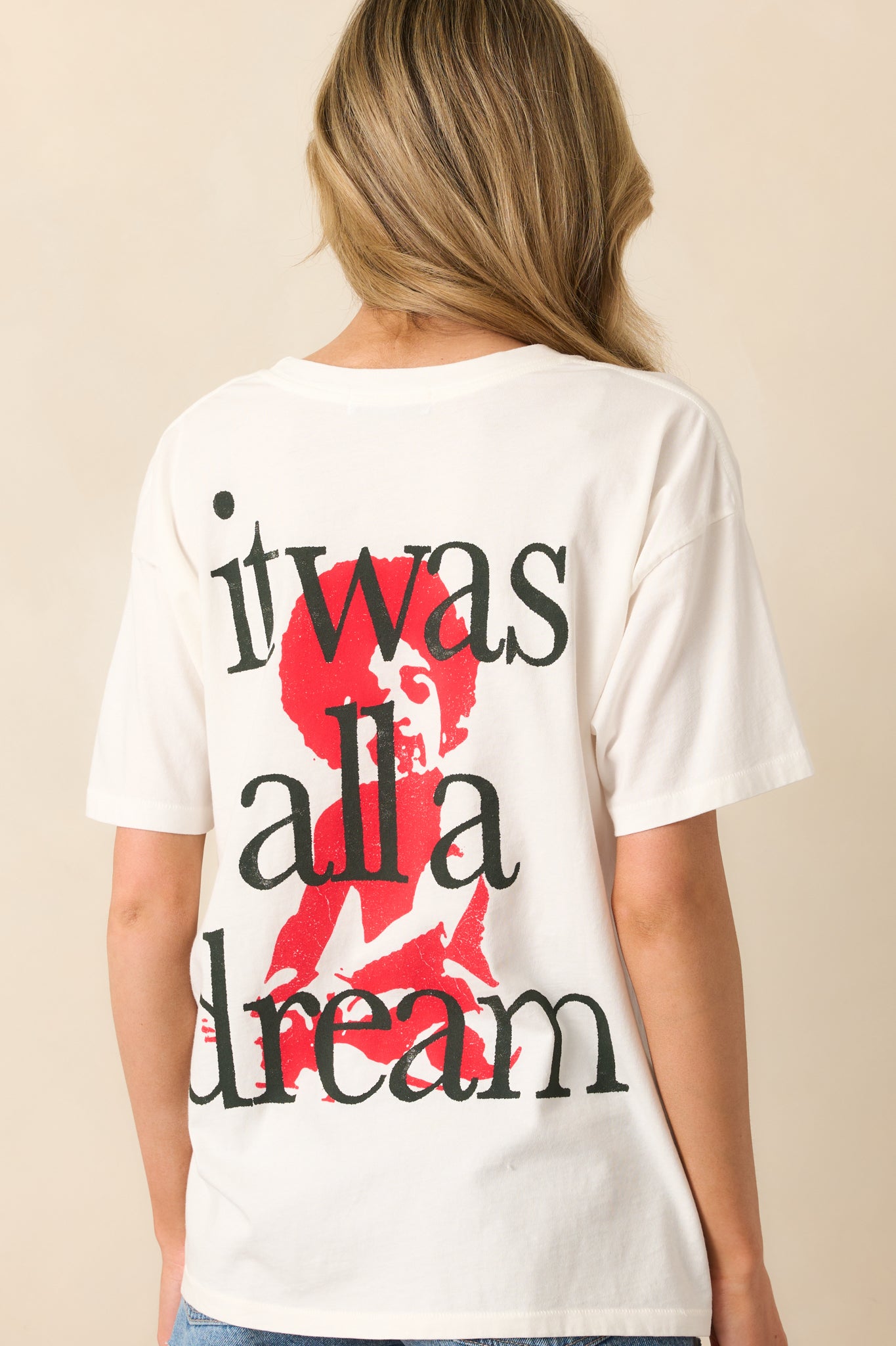 Back view of the vintage white tee, showing the plain design and relaxed fit without the graphic.