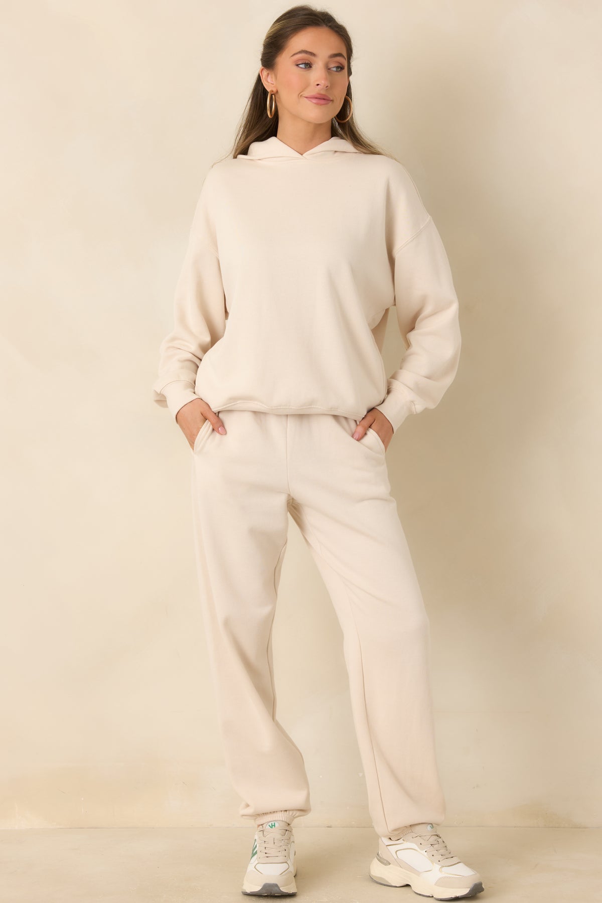Relaxed beige joggers with a smooth fleece finish and an easy tapered silhouette.