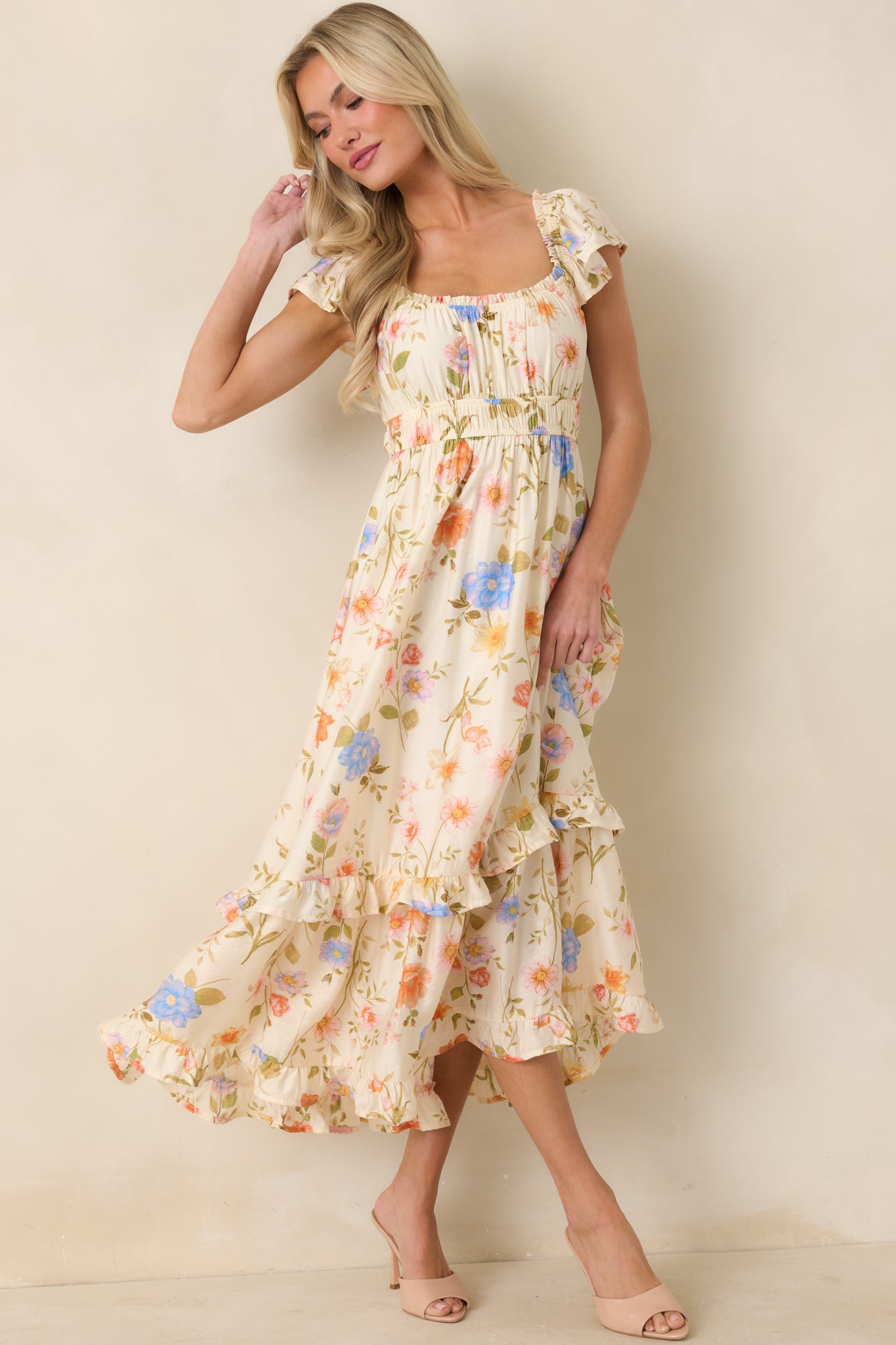 Light beige multi floral midi dress with scoop neckline, flutter sleeves, and gathered bust detail.