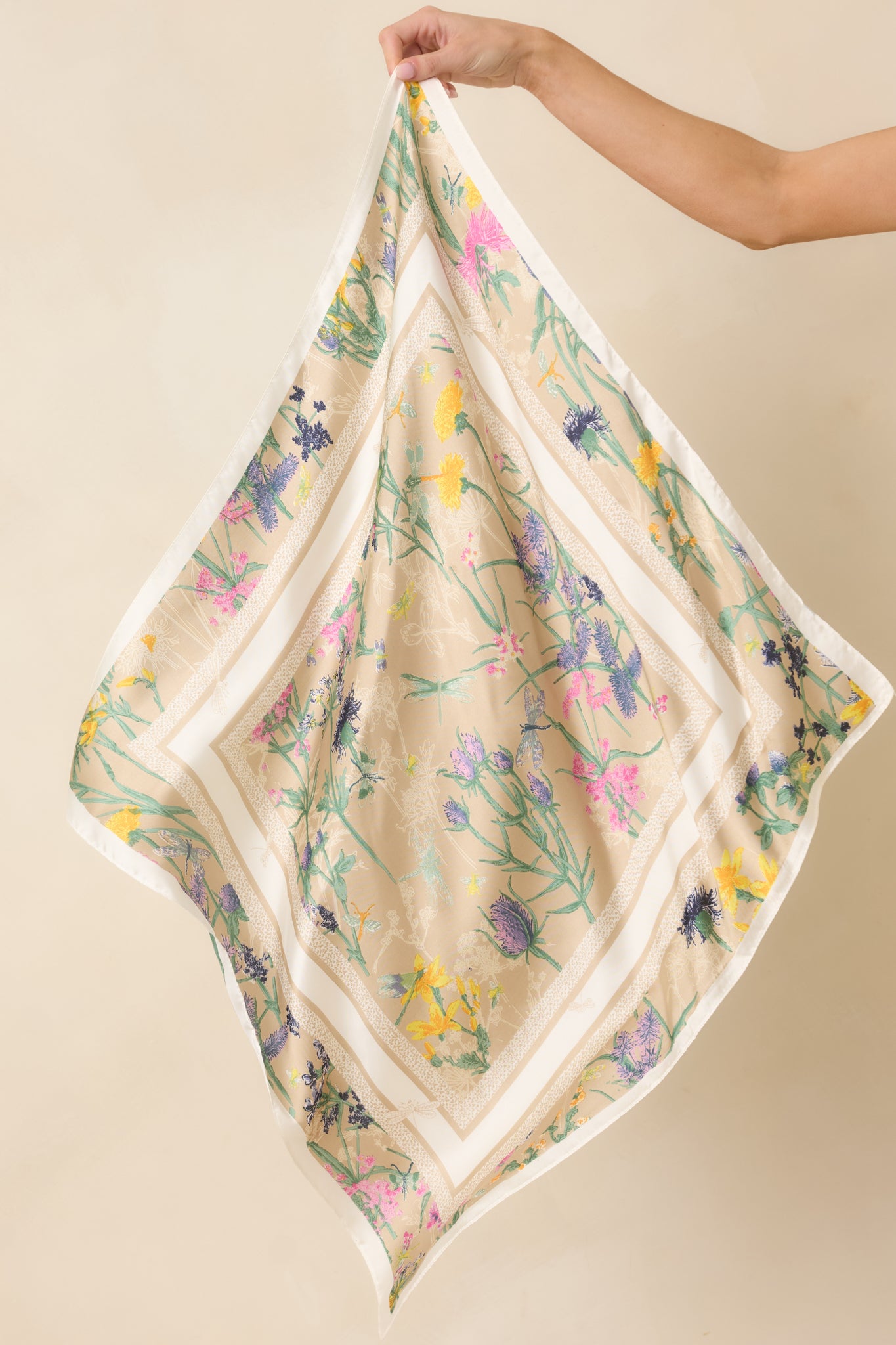 Full view of the beige scarf showcasing the multicolor floral print and square satin design.