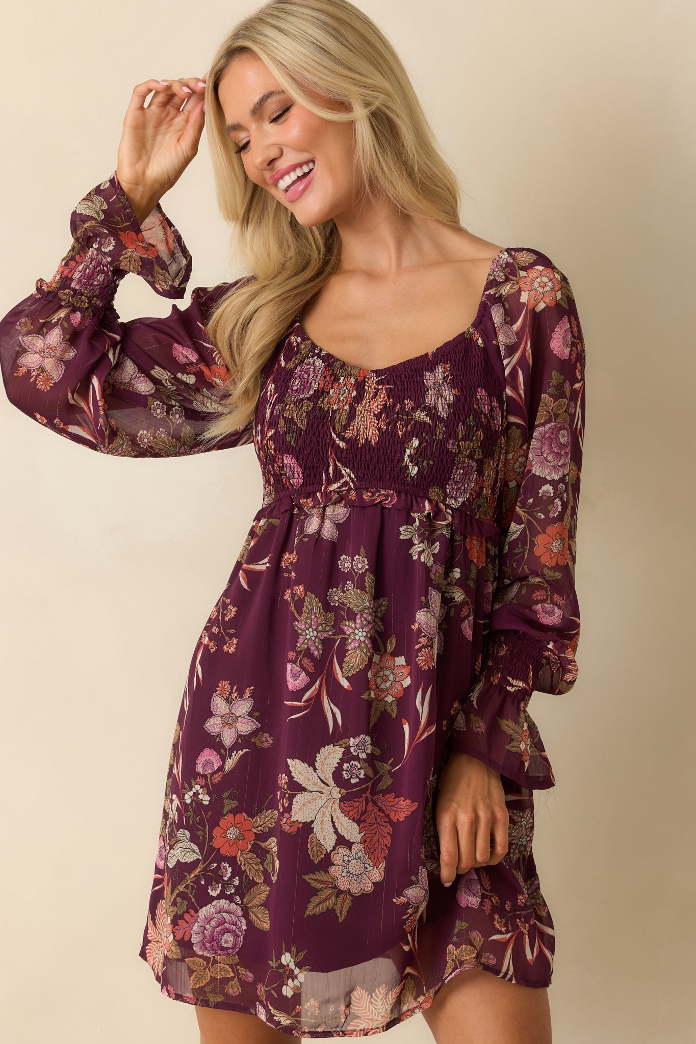 Berry purple floral print detail at bodice and upper skirt of mini dress.