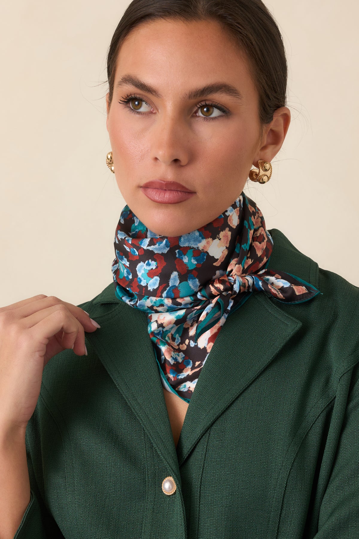 Black scarf showcasing the colorful abstract animal print and narrow teal border.
