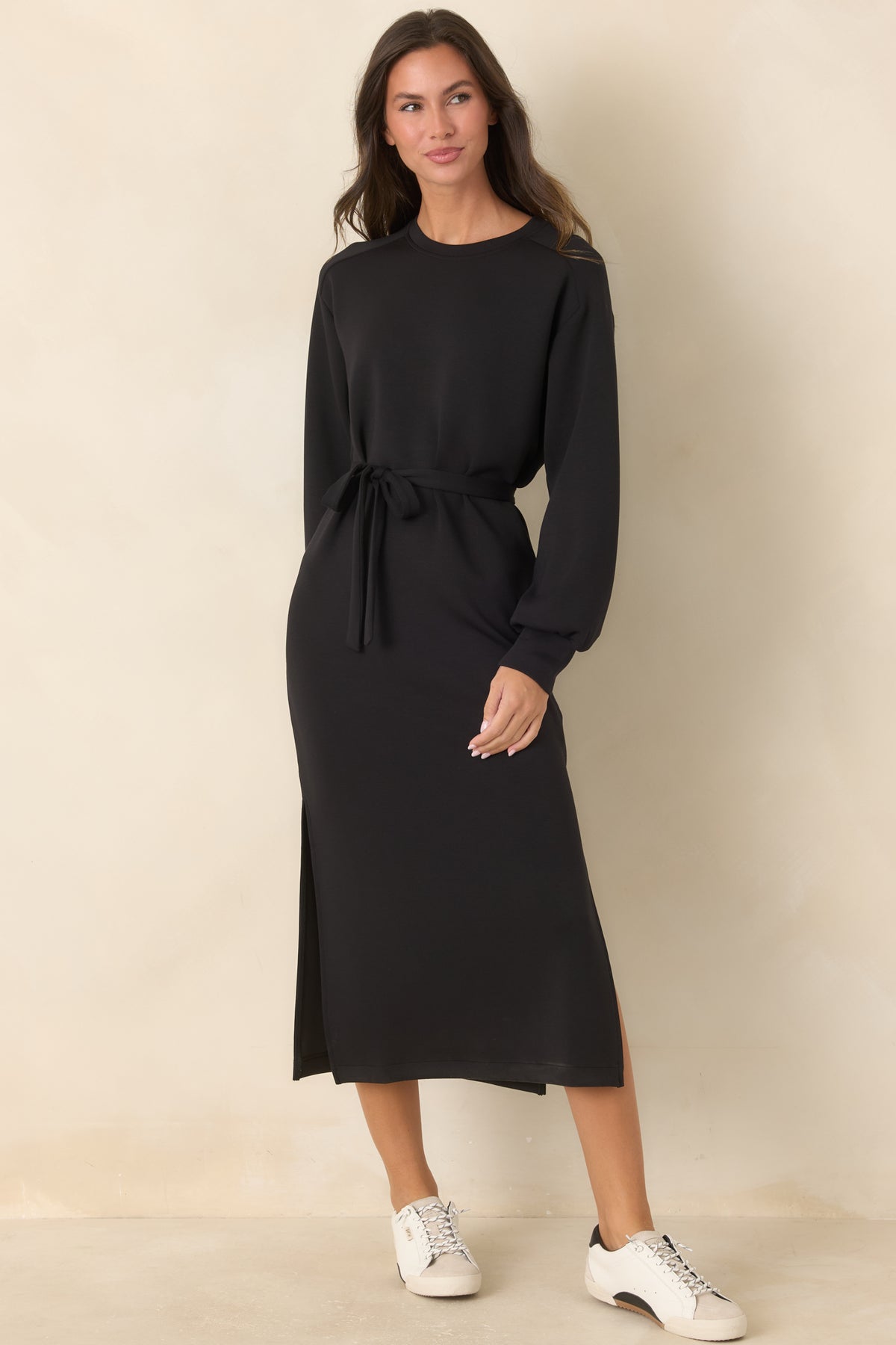 Classic black midi dress featuring banded cuffs and a defined waist with a matching tie.