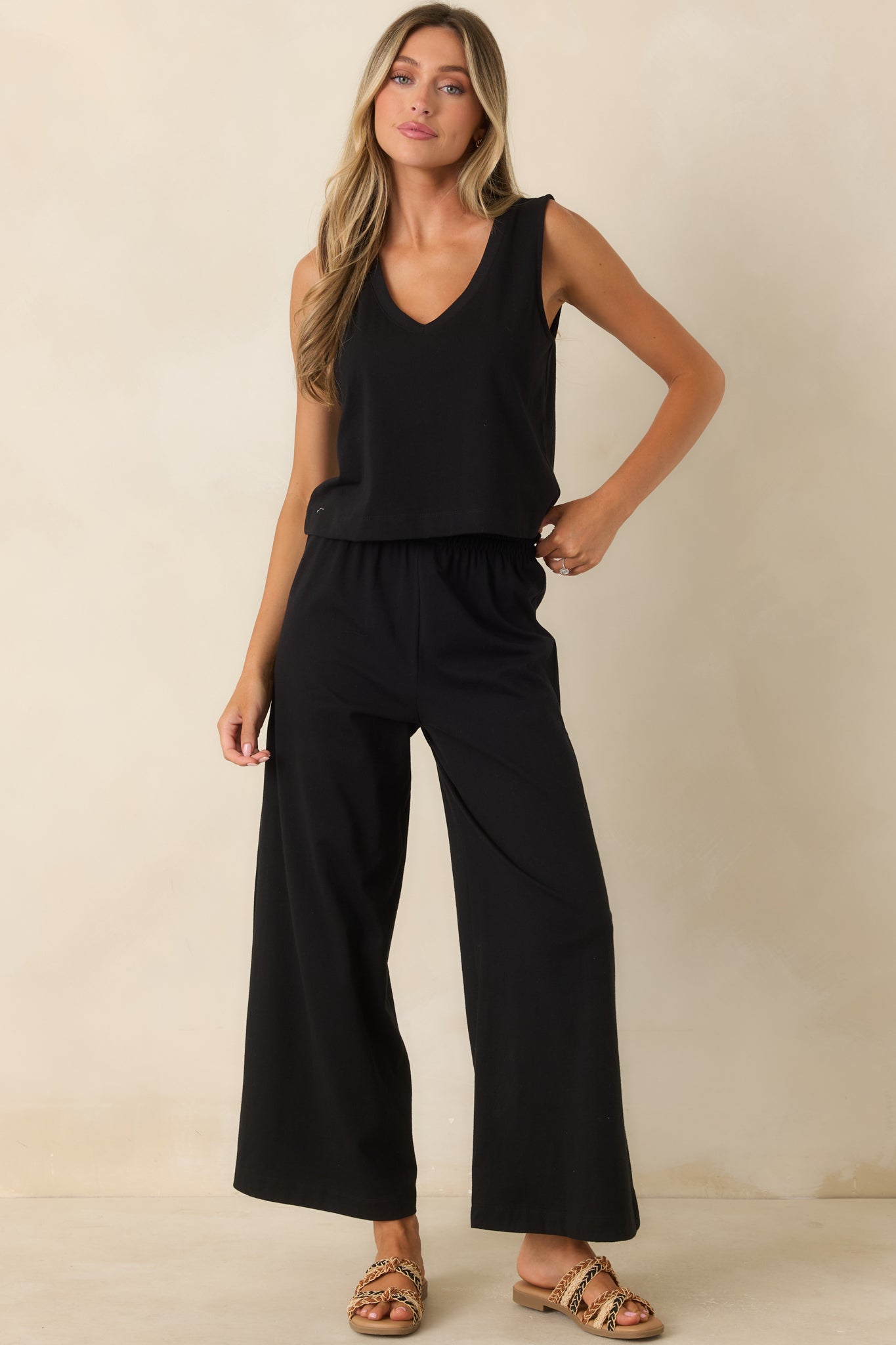 Black cotton jersey pants featuring a wide leg design, high waist, and relaxed fit.