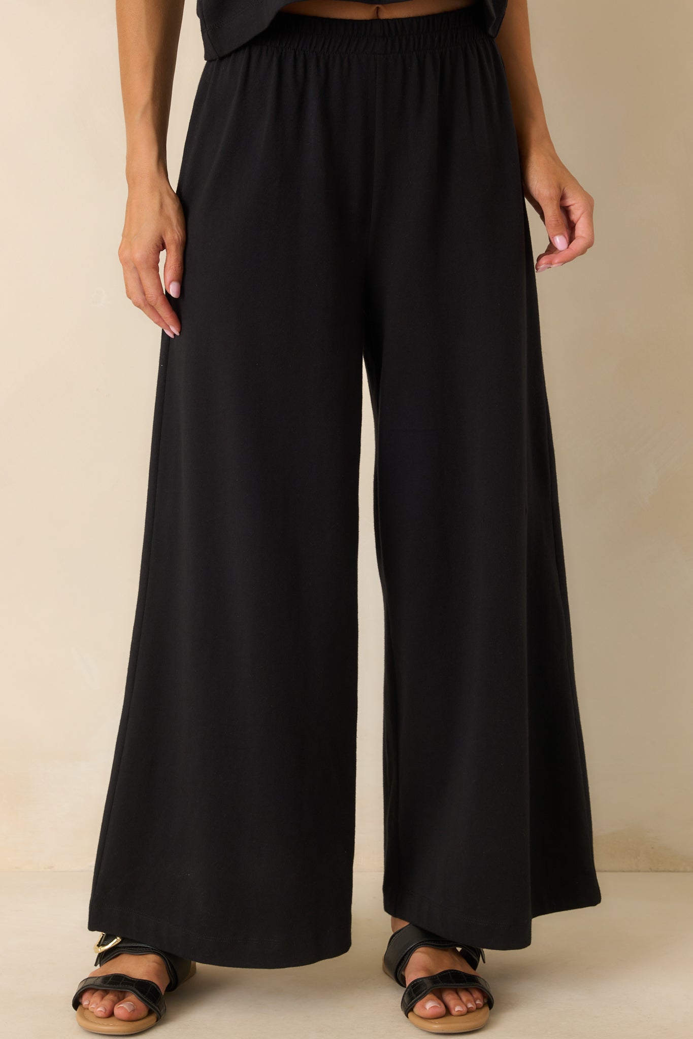 A cropped front view focusing on the high waisted rise and gathered detailing at the elastic waistband.