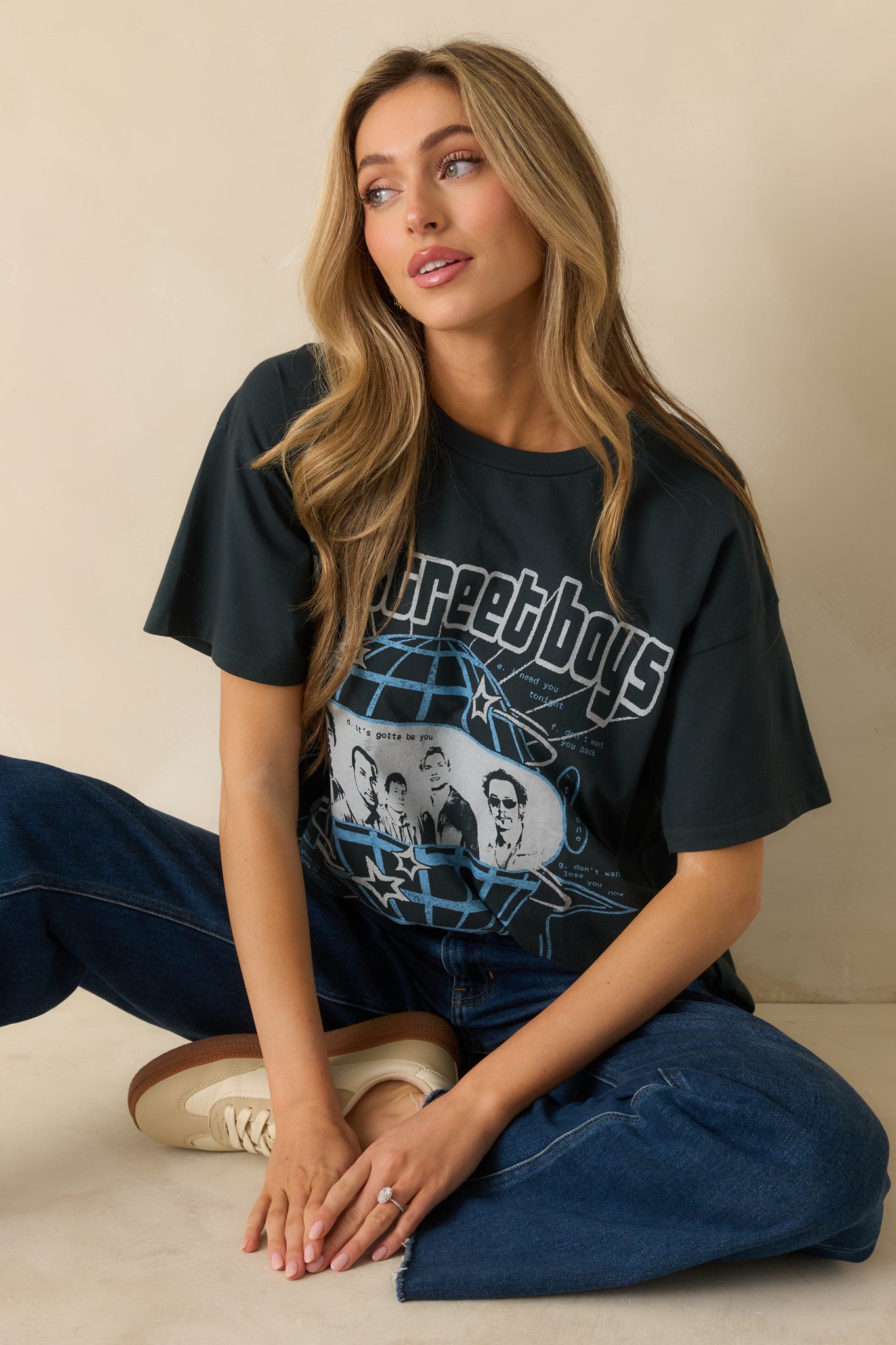 Black cotton graphic tee with a vintage Backstreet Boys Millennium tour design and short sleeves.