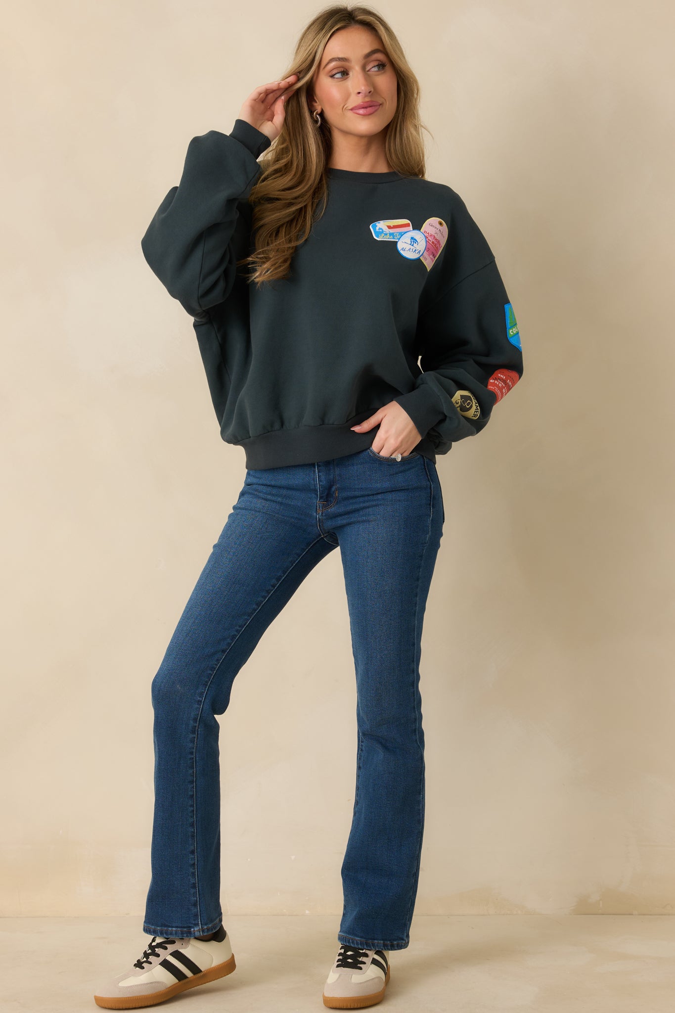 Black crewneck sweatshirt highlighting ribbed trim and relaxed fleece-lined silhouette.