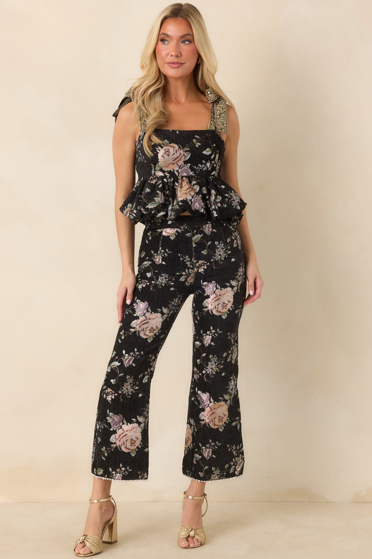 Textured black cropped pants featuring a fitted silhouette, defined waistband, and delicate beaded hem trim.