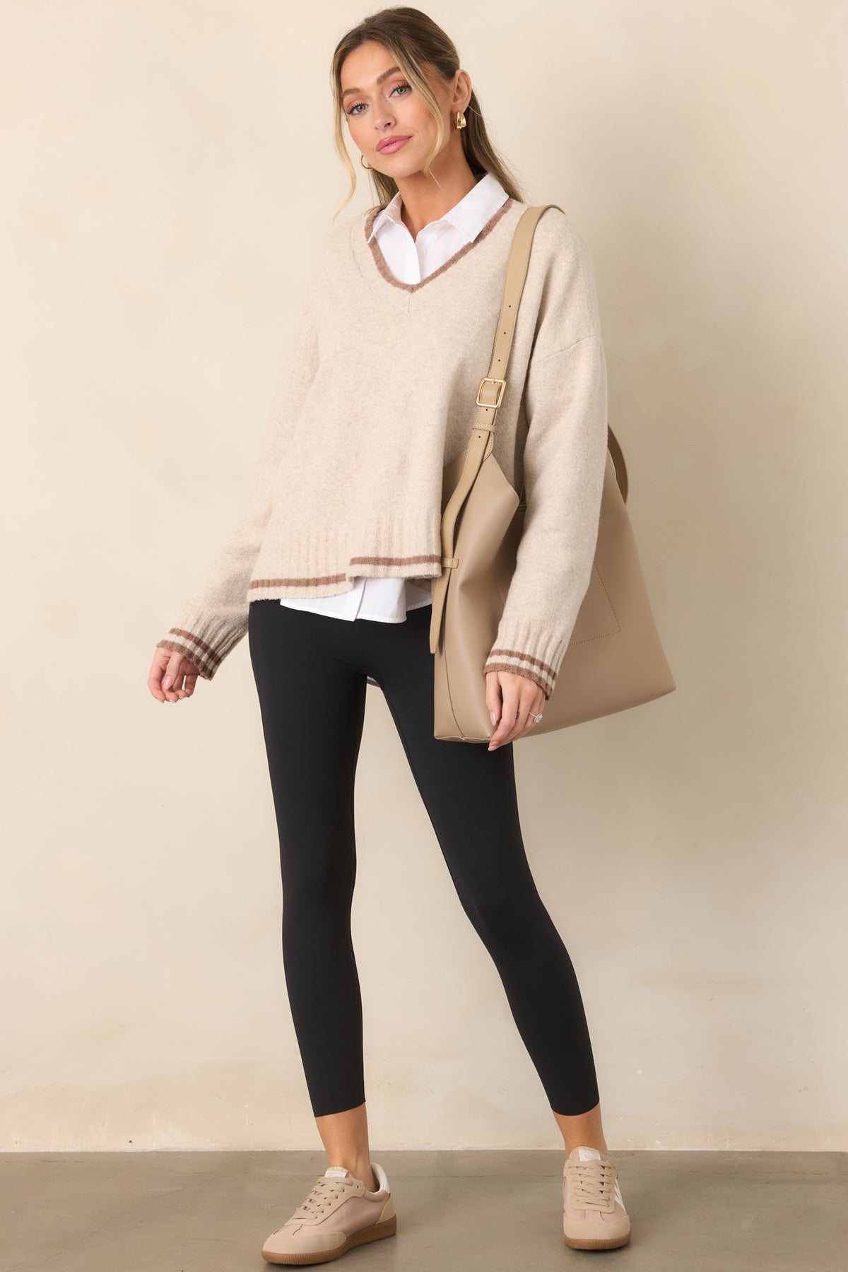 Black high-rise leggings showcasing the contoured waistband and smooth fitted silhouette.