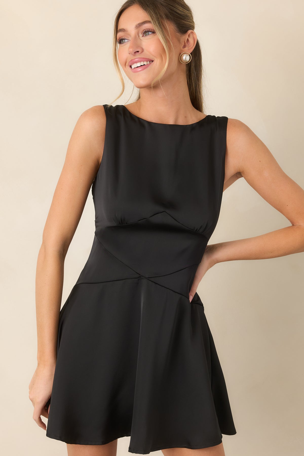 Black satin bodice with a refined bateau neckline and contoured seams creating a defined waist.