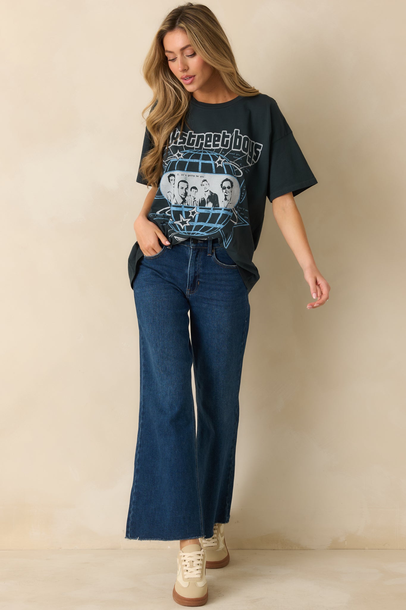 Short-sleeve black tee with classic cotton fabric and a retro band print.