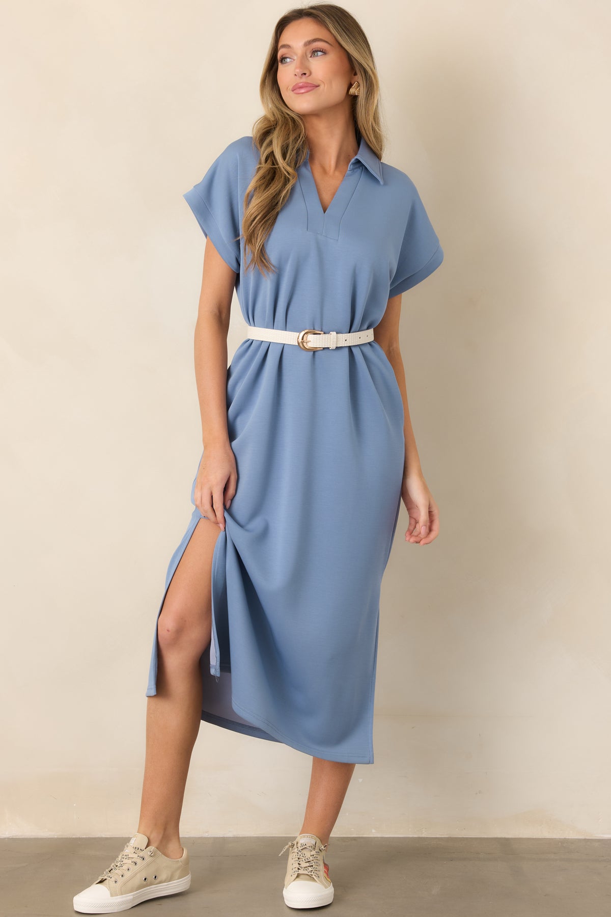Classic blue midi dress showcasing a collared V-neckline, easy-fitting bodice, short sleeves, and side leg vents.