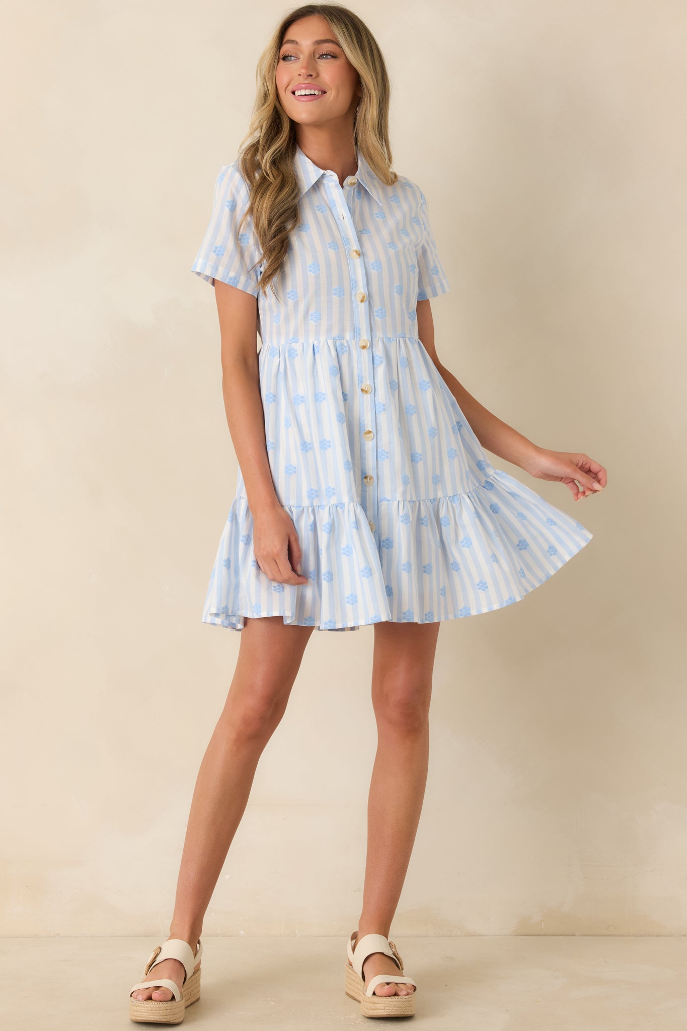 Blue stripe cotton dress with floral embroidered detailing, short sleeves, a classic collar, button-down front, and breezy mini length.