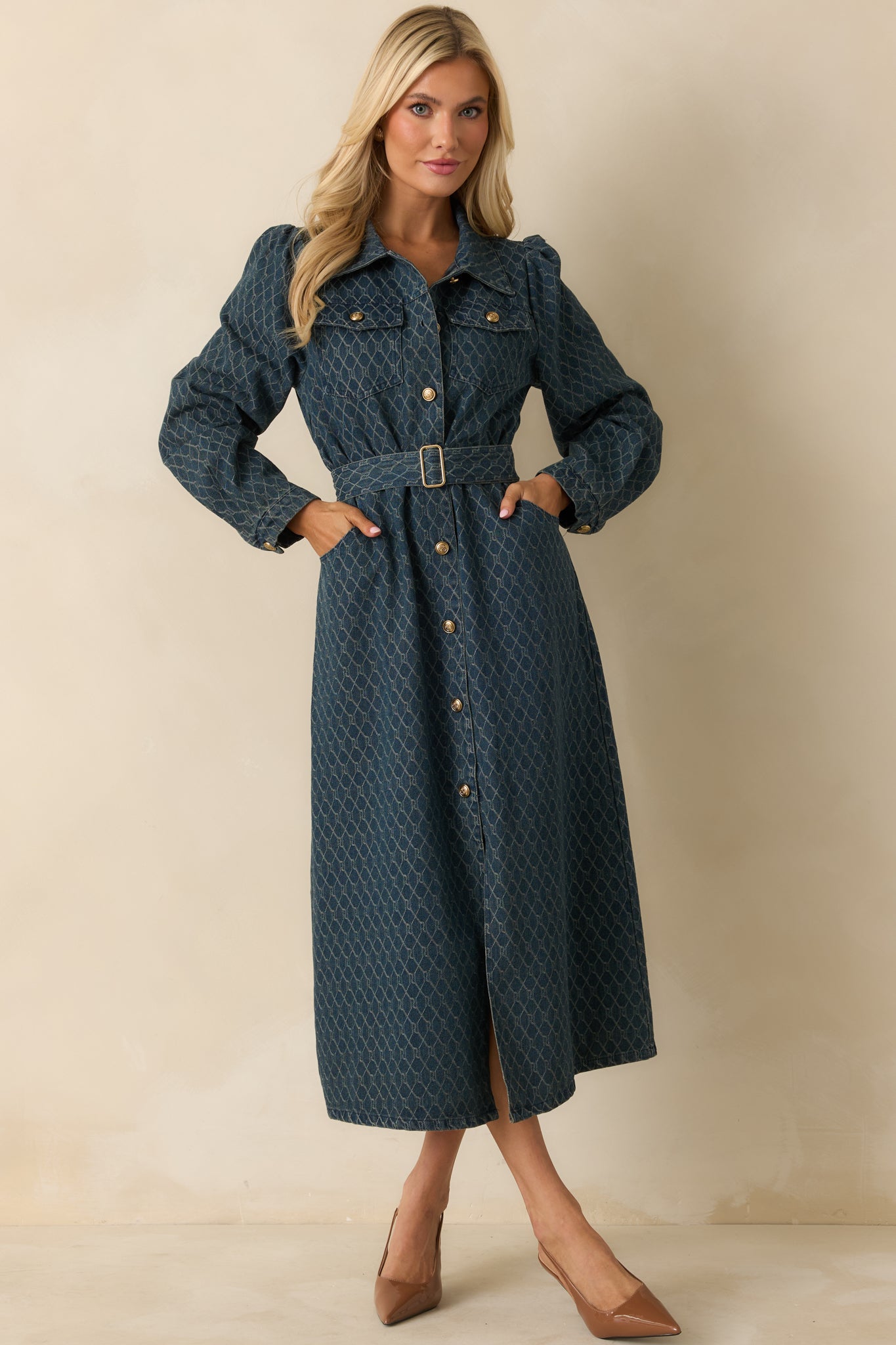 Front-facing blue cotton denim midi dress emphasizing the removable self-tie belt and structured silhouette.