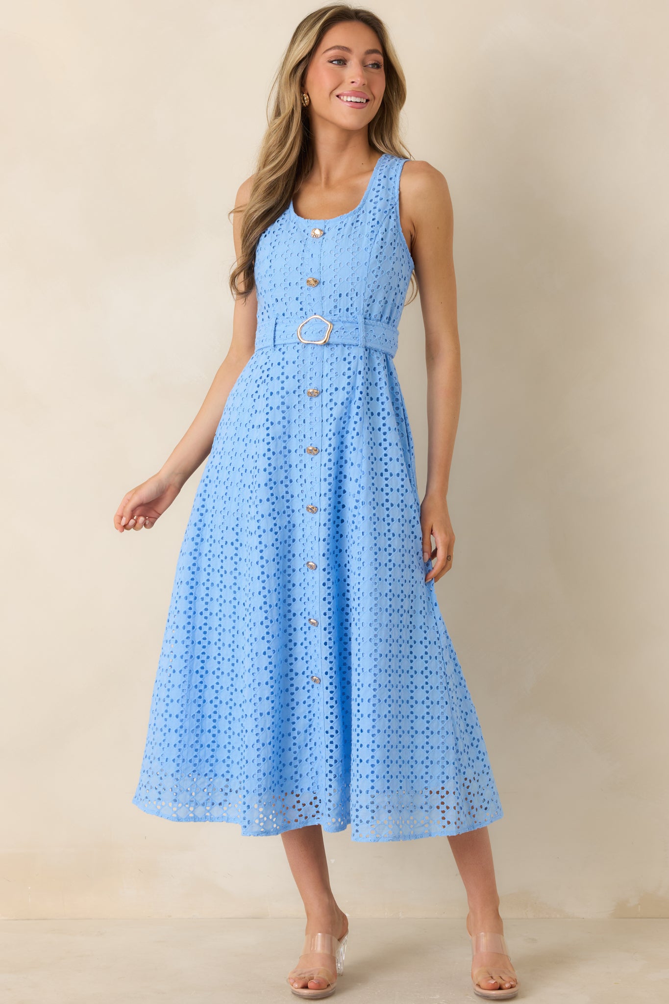 Blue eyelet midi dress with soft lining, faux button front, and a flattering cinched waist silhouette