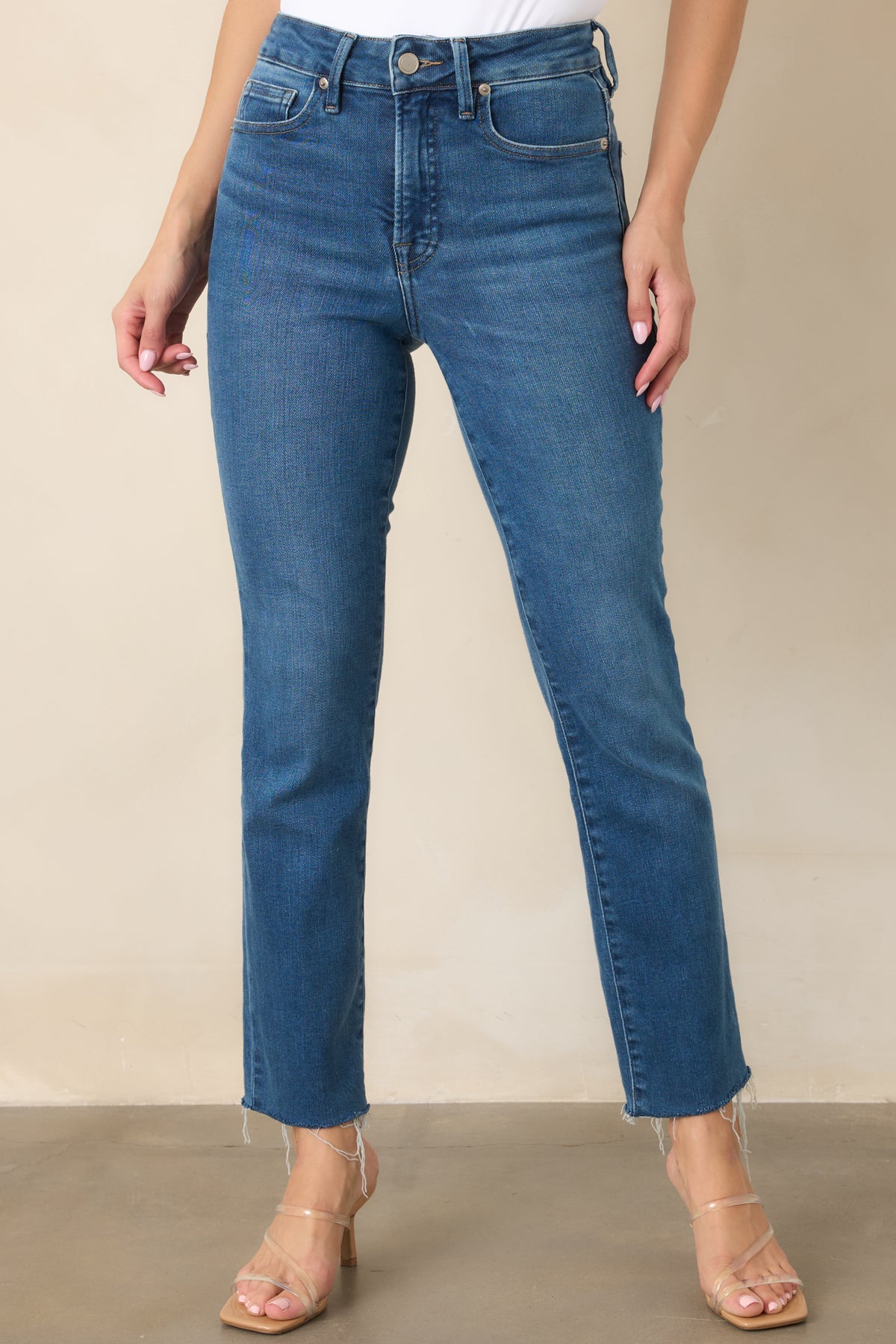 Blue denim-style pants with softly faded detailing, a defined waistband, and versatile straight legs.