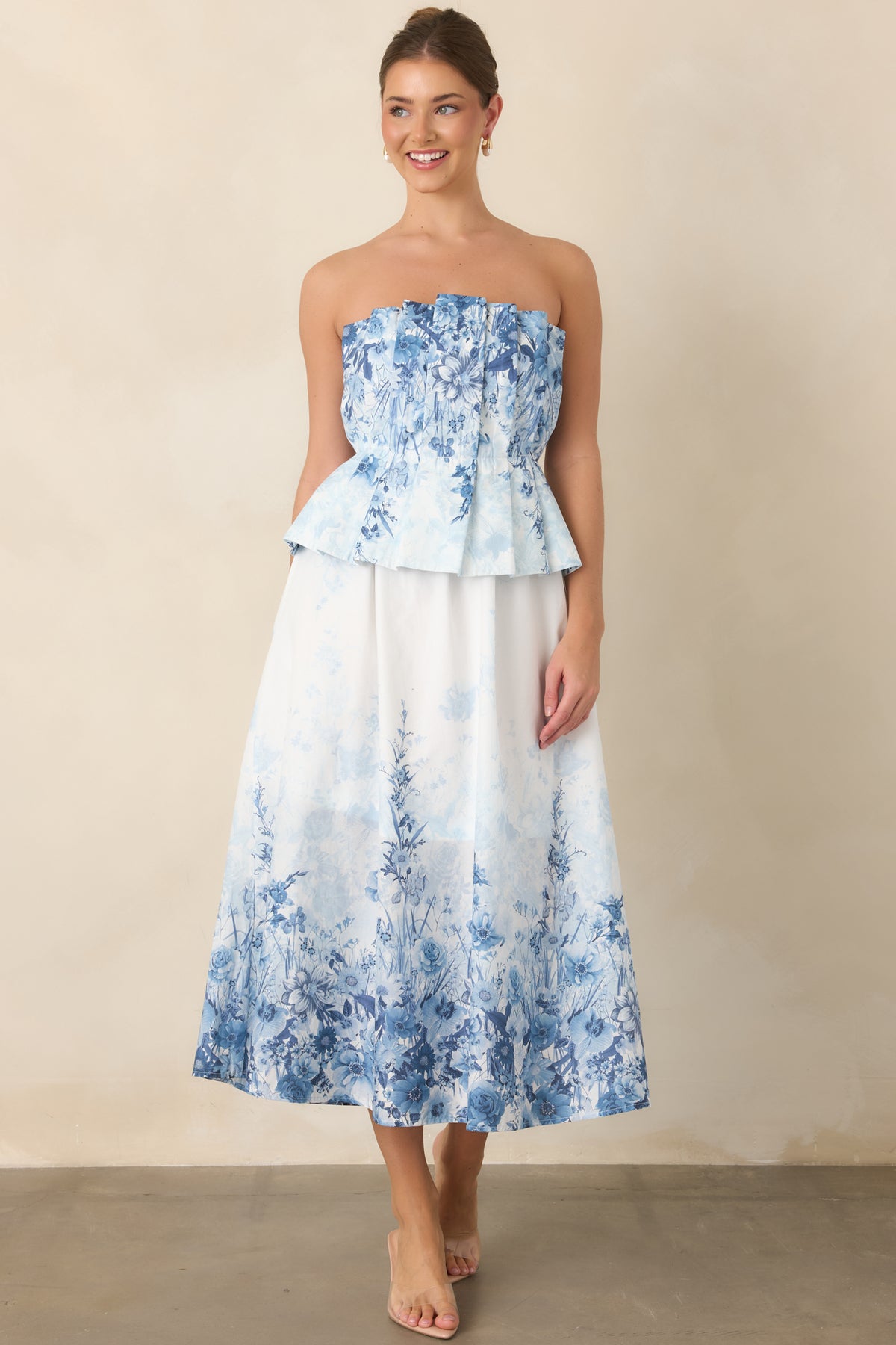 Blue floral cotton midi dress with a strapless pleated bodice and elasticized waistband.