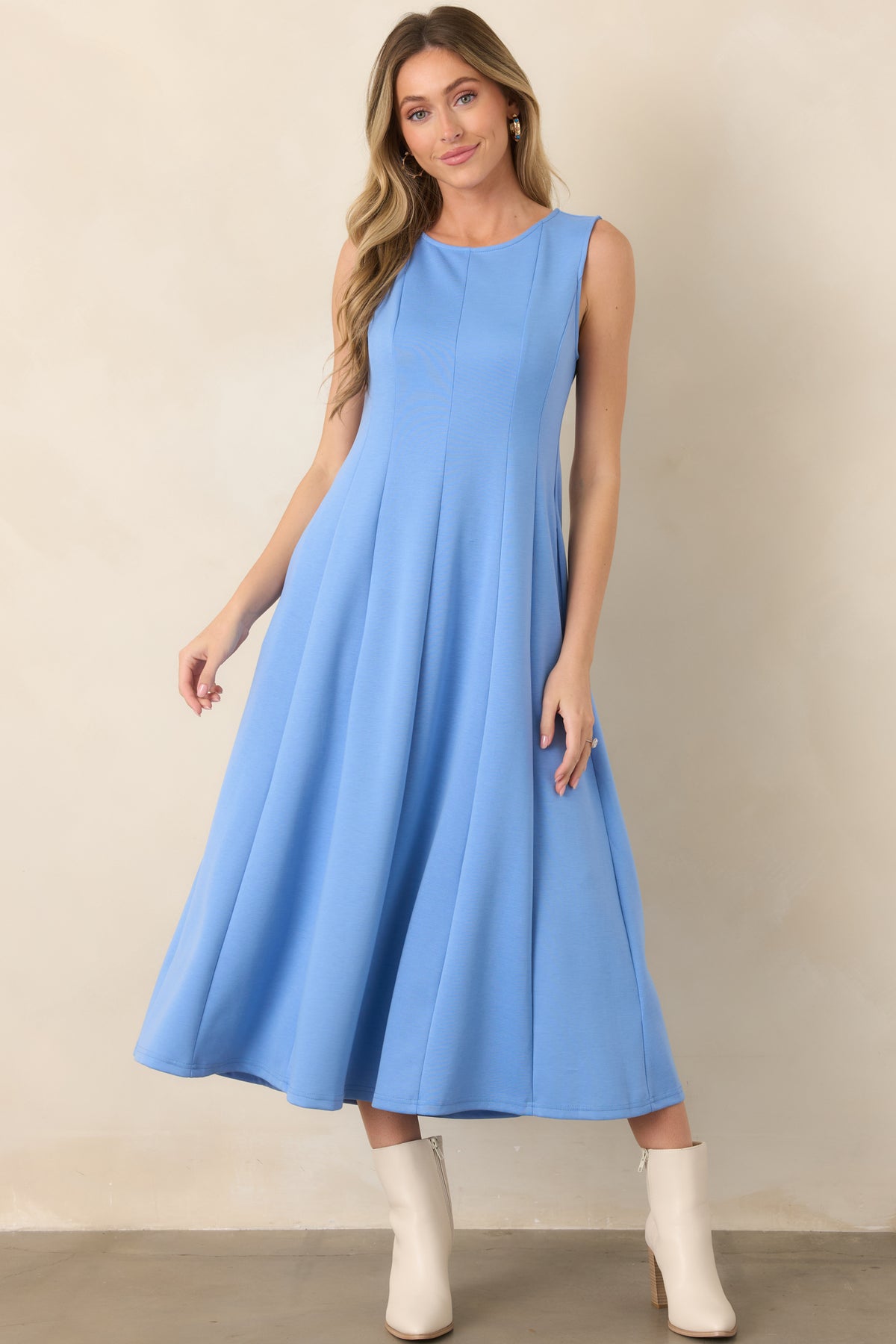 Relaxed blue midi dress featuring a pull-on construction, smooth panel seams, and graceful fabric draping from neckline to hem.