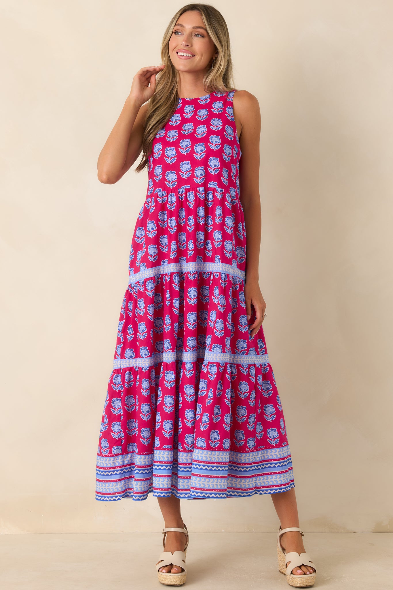 Colorful printed midi dress featuring detailed border trim, a relaxed fit, and an airy silhouette.