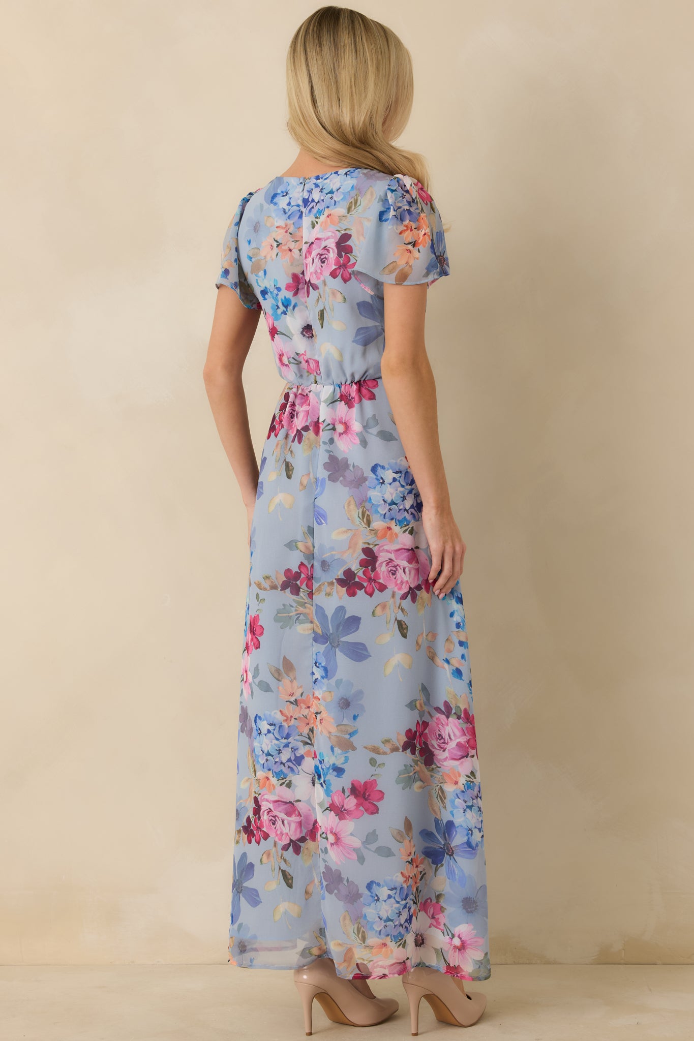 Blue multicolor maxi dress with a flowing lined skirt and concealed zipper closure at the rear.