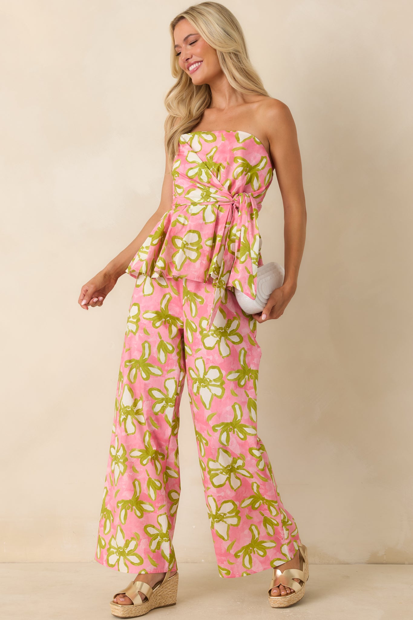 Bold floral print wide-leg pants featuring a relaxed drape, elastic waistband, and adjustable drawstring for an easy, comfortable fit.