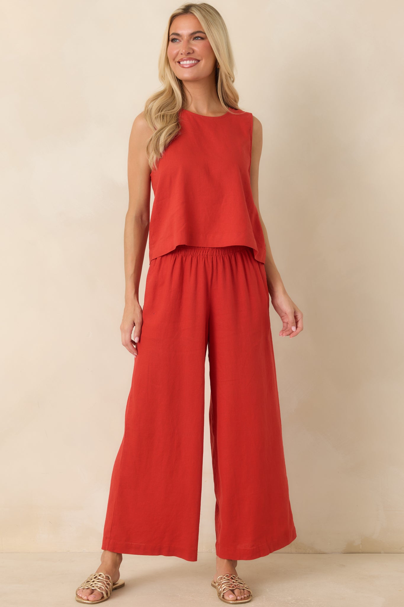Bold red pants showcasing a comfortable silhouette, versatile design, and easygoing appeal.
