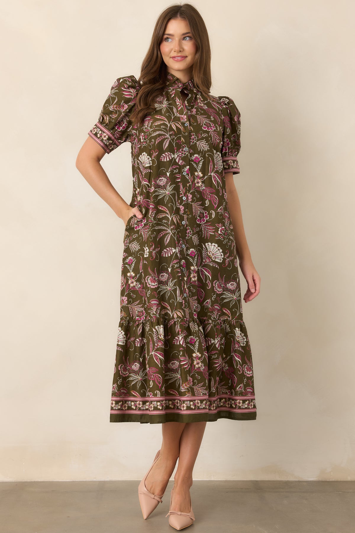 Botanical print dress with a classic button-front closure and graceful collared neckline.