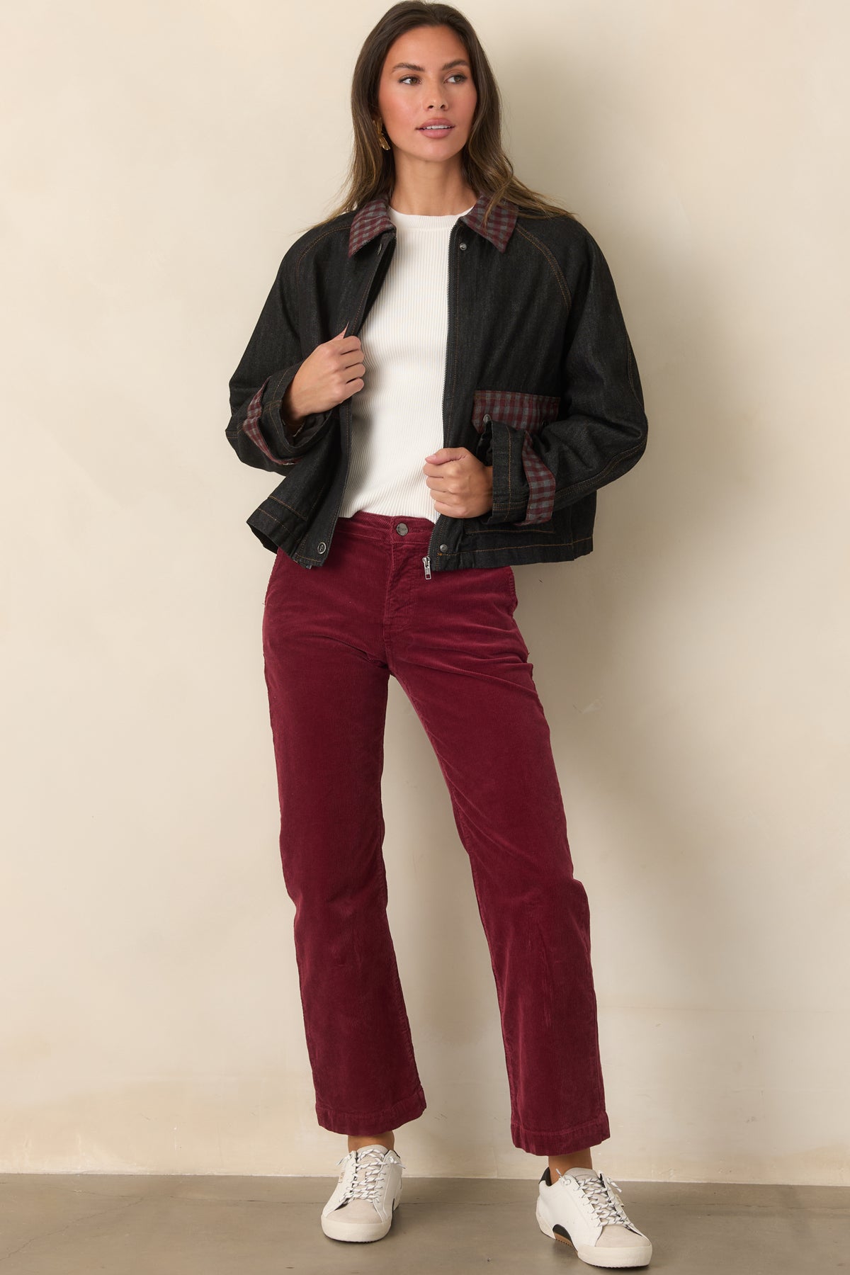 Boxy blue denim jacket with retro gingham details at the collar, cuffs, and front pocket flaps.