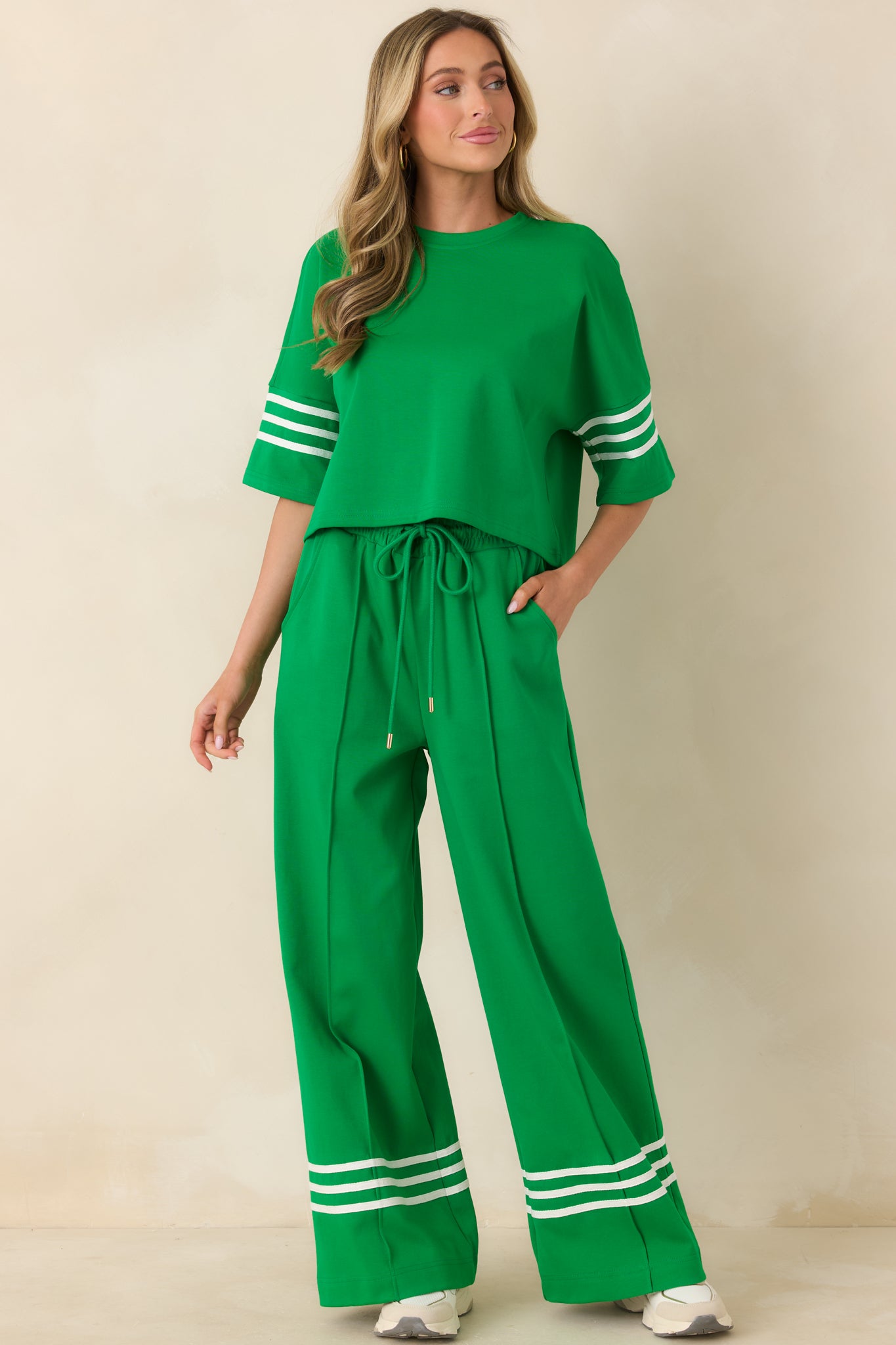Boxy cotton blend top with crew neckline and short sleeves, highlighted by clean contrast stripe accents and easy movement.
