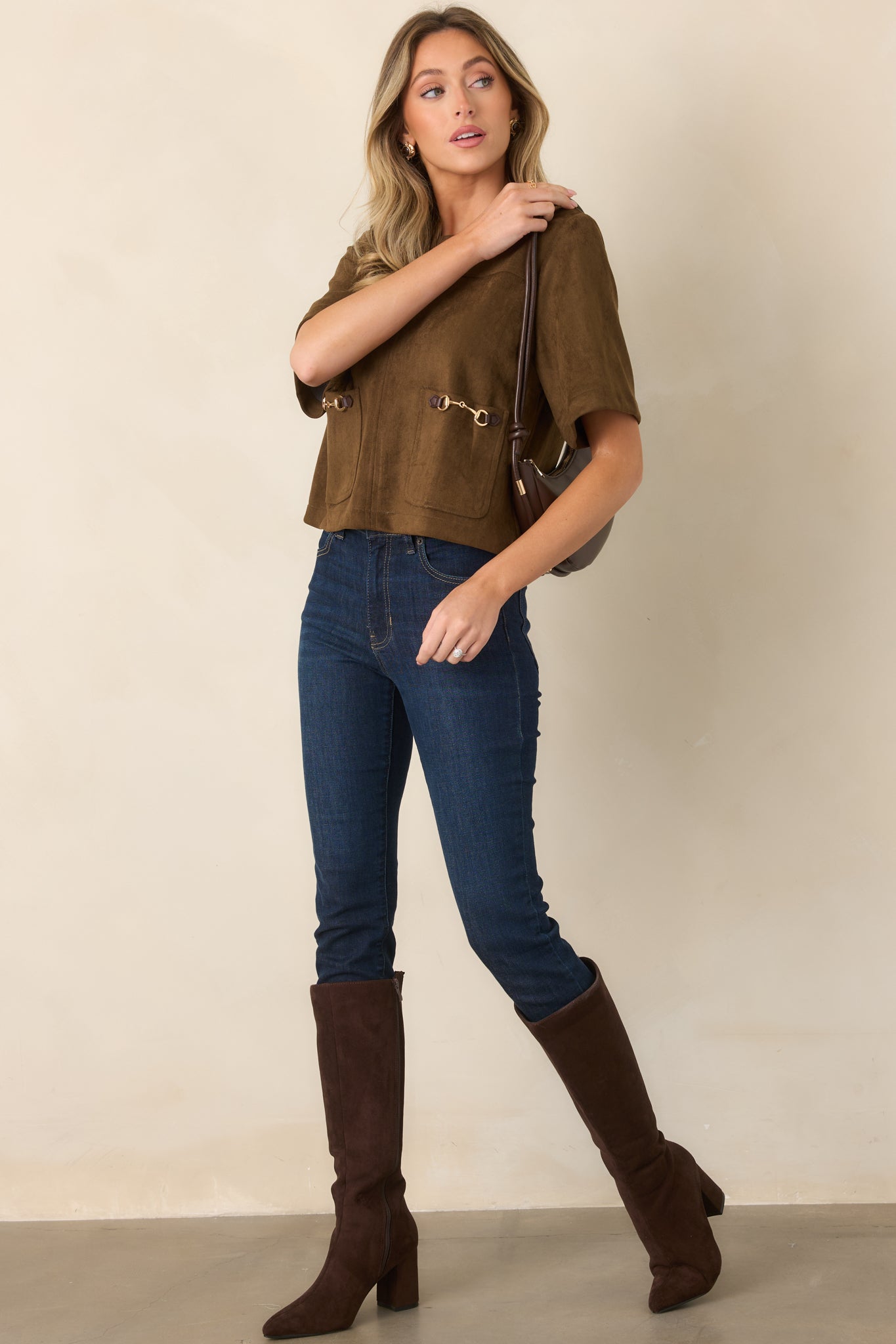 Boxy suede-like top with a clean round neckline, short sleeves, and statement front pockets.