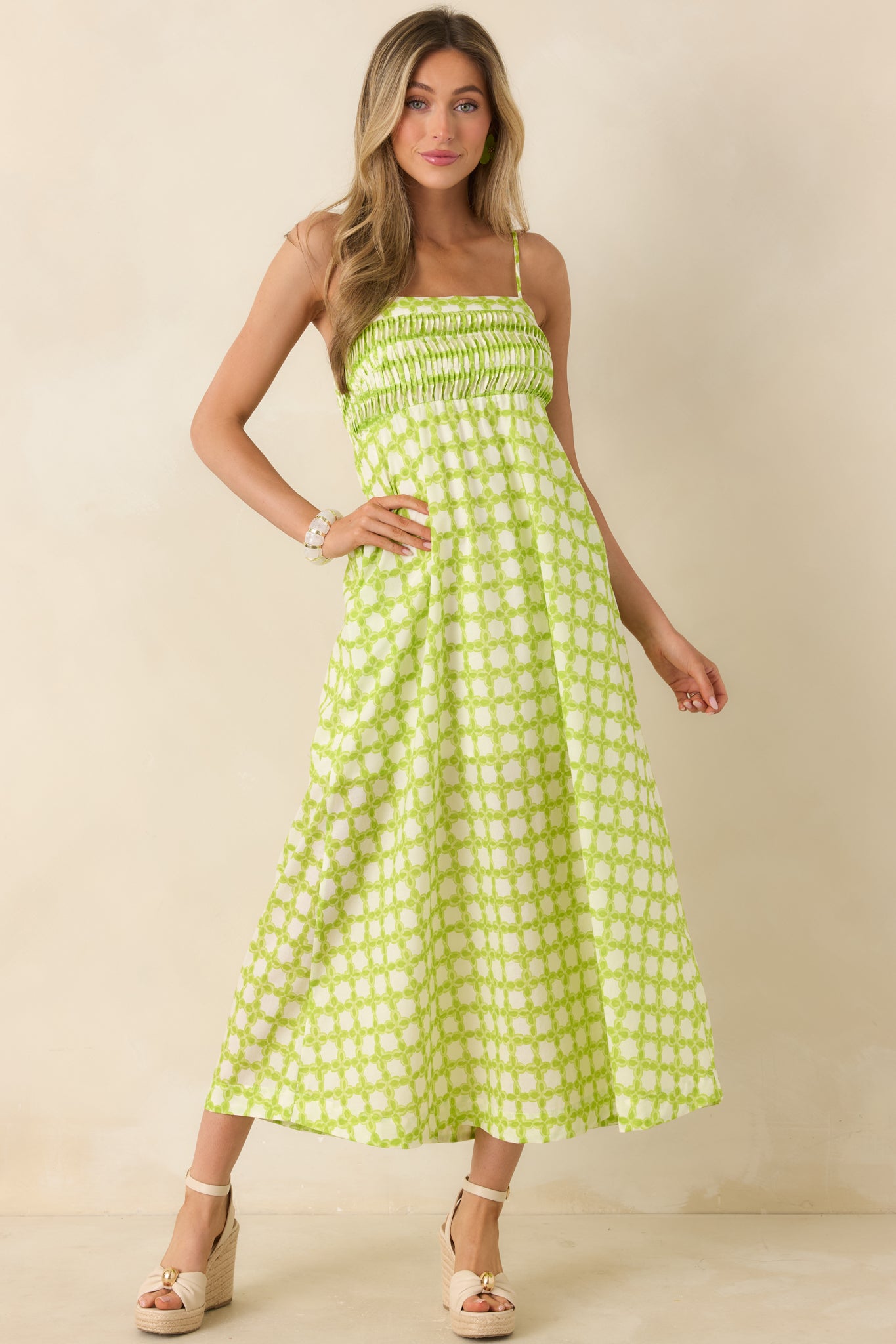 Breathable cotton dress featuring vertical pleating, a smocked bodice, and a relaxed midi silhouette.