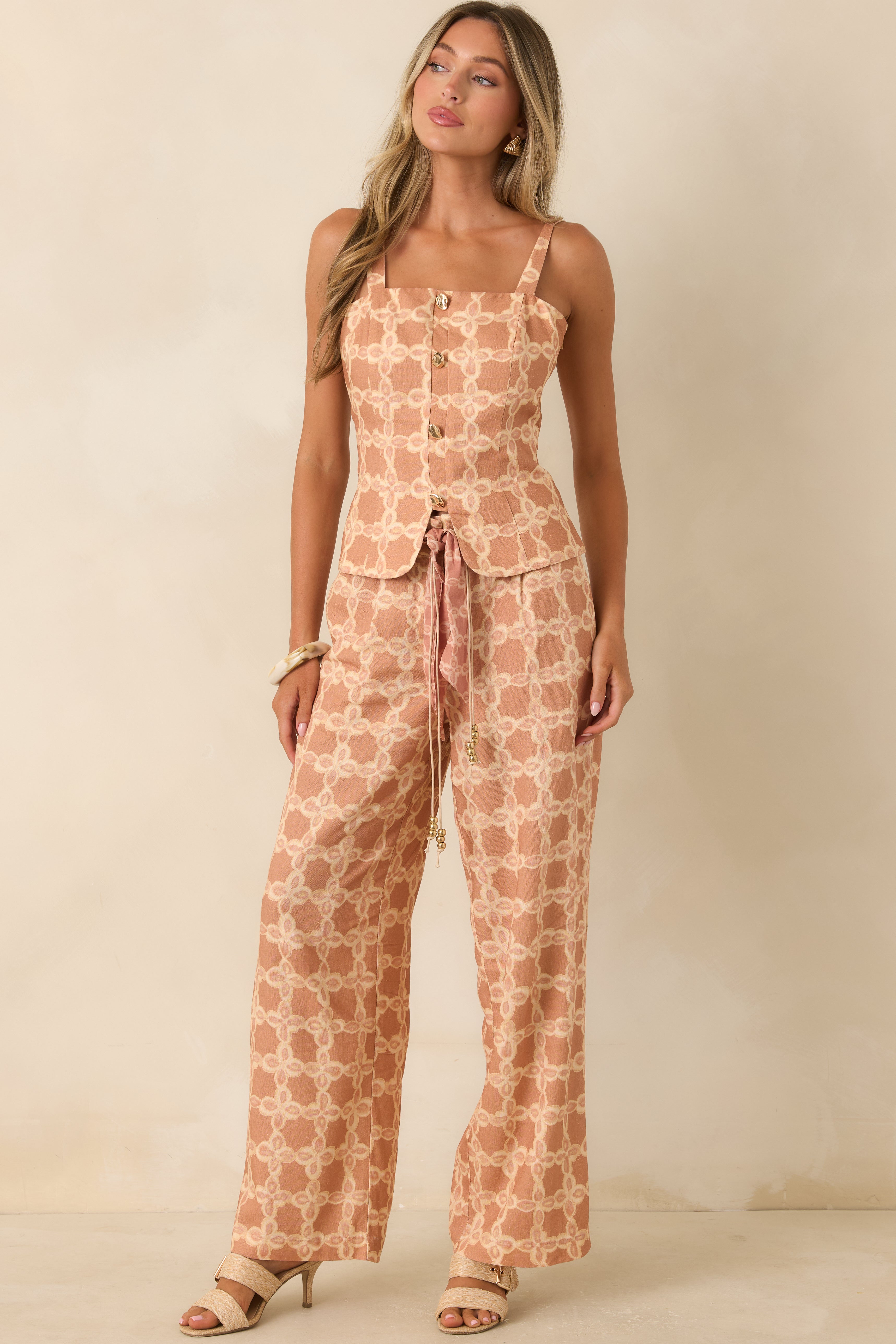 Breathable woven top featuring a square neckline, button detailing, and a refined vintage-inspired print.