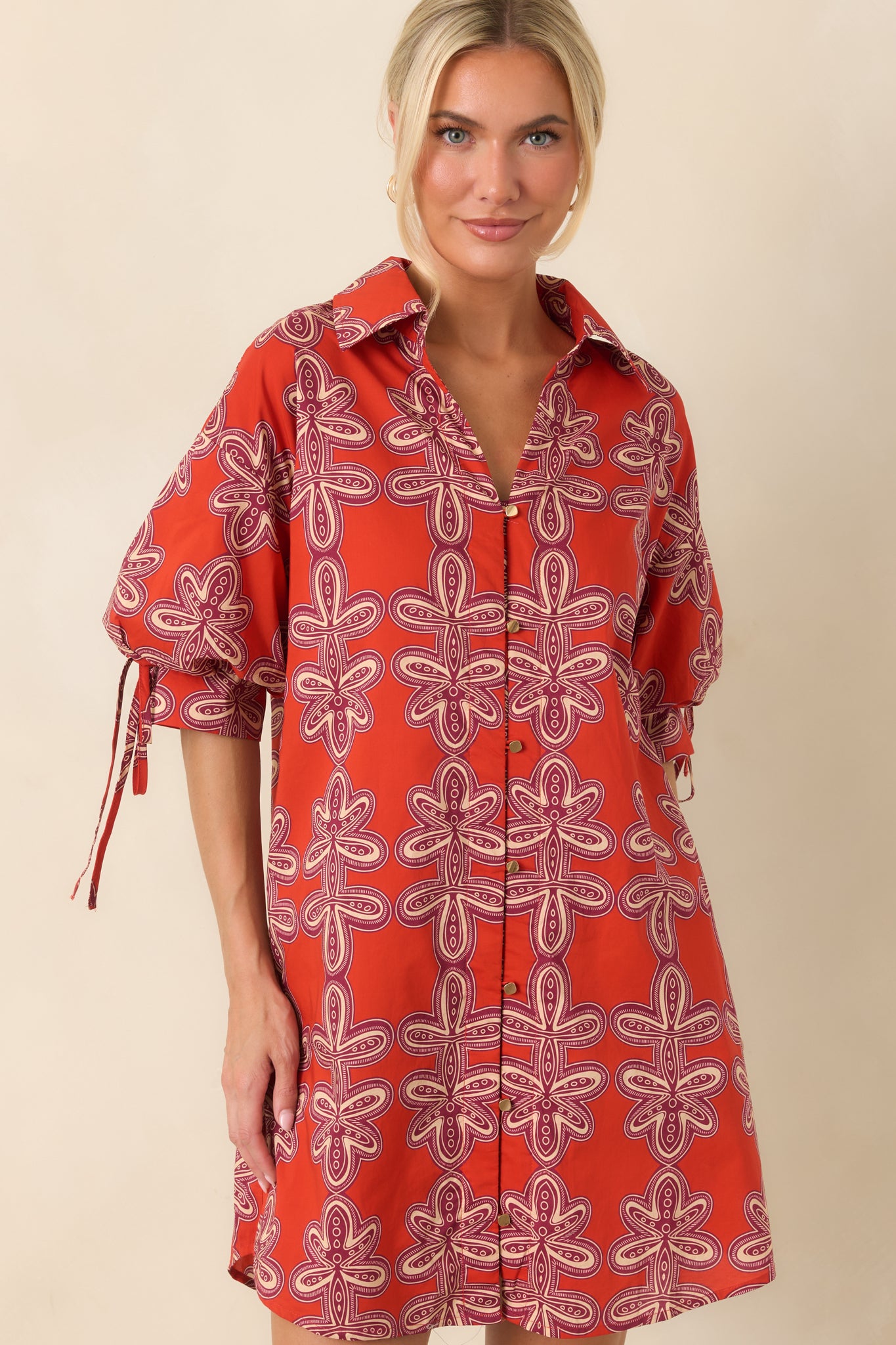 Vintage-inspired brick red and burgundy print stands out on the breathable cotton fabric of this mini dress.