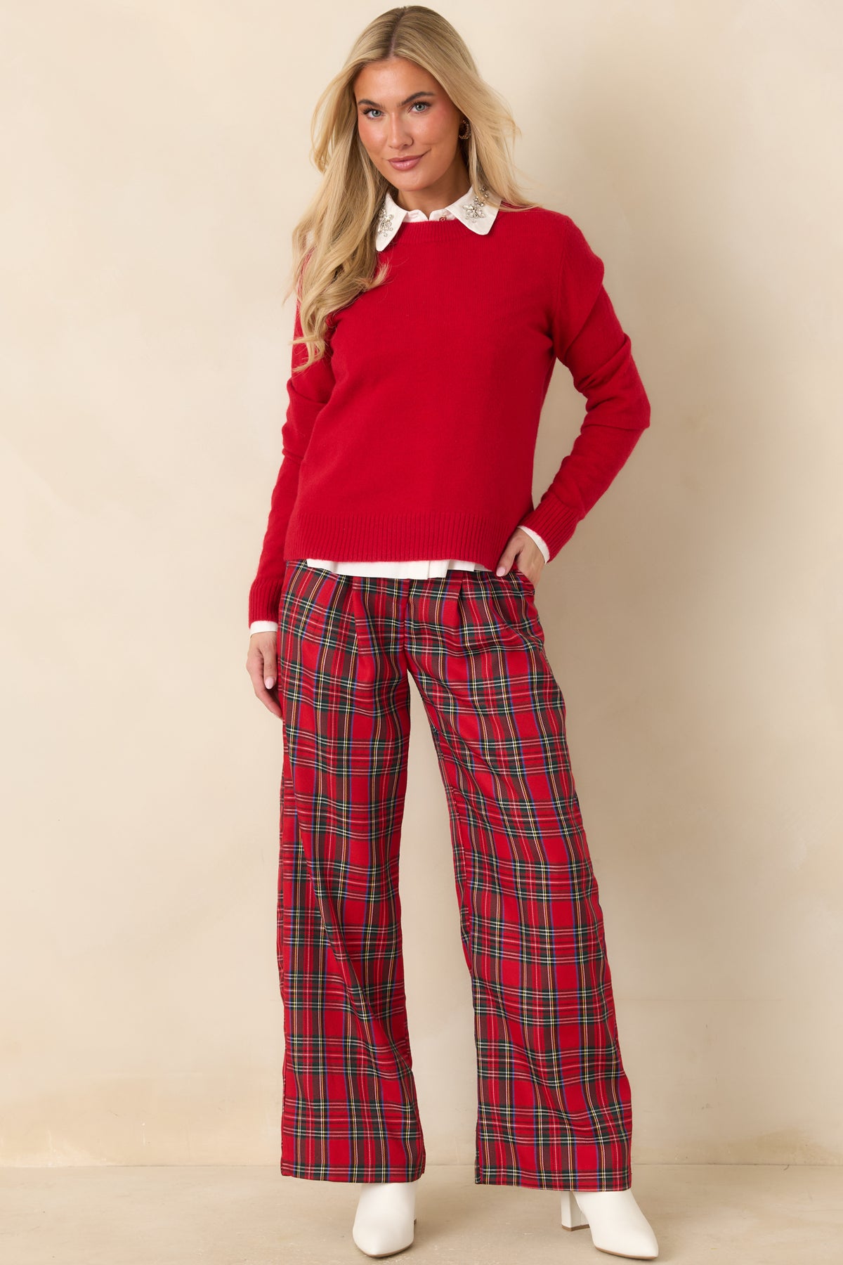 Bright red knit top with a crew neckline, long sleeves, and ribbed trim.