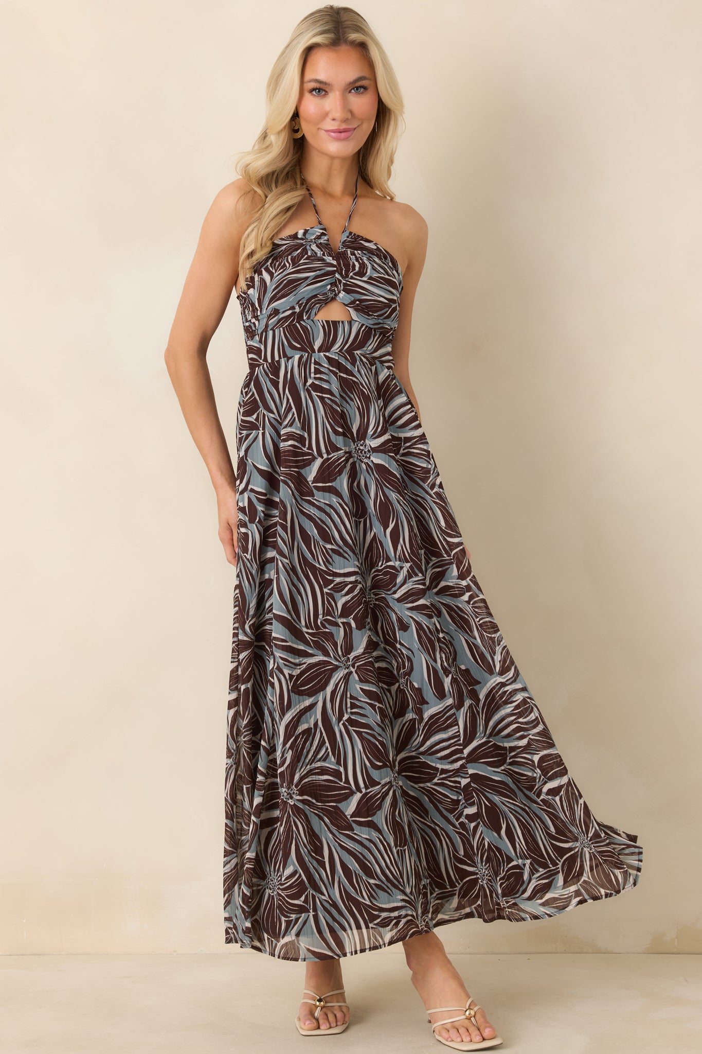 Brown and blue maxi dress showcasing twisted bodice, full-length flowing skirt, and lightweight fabric.