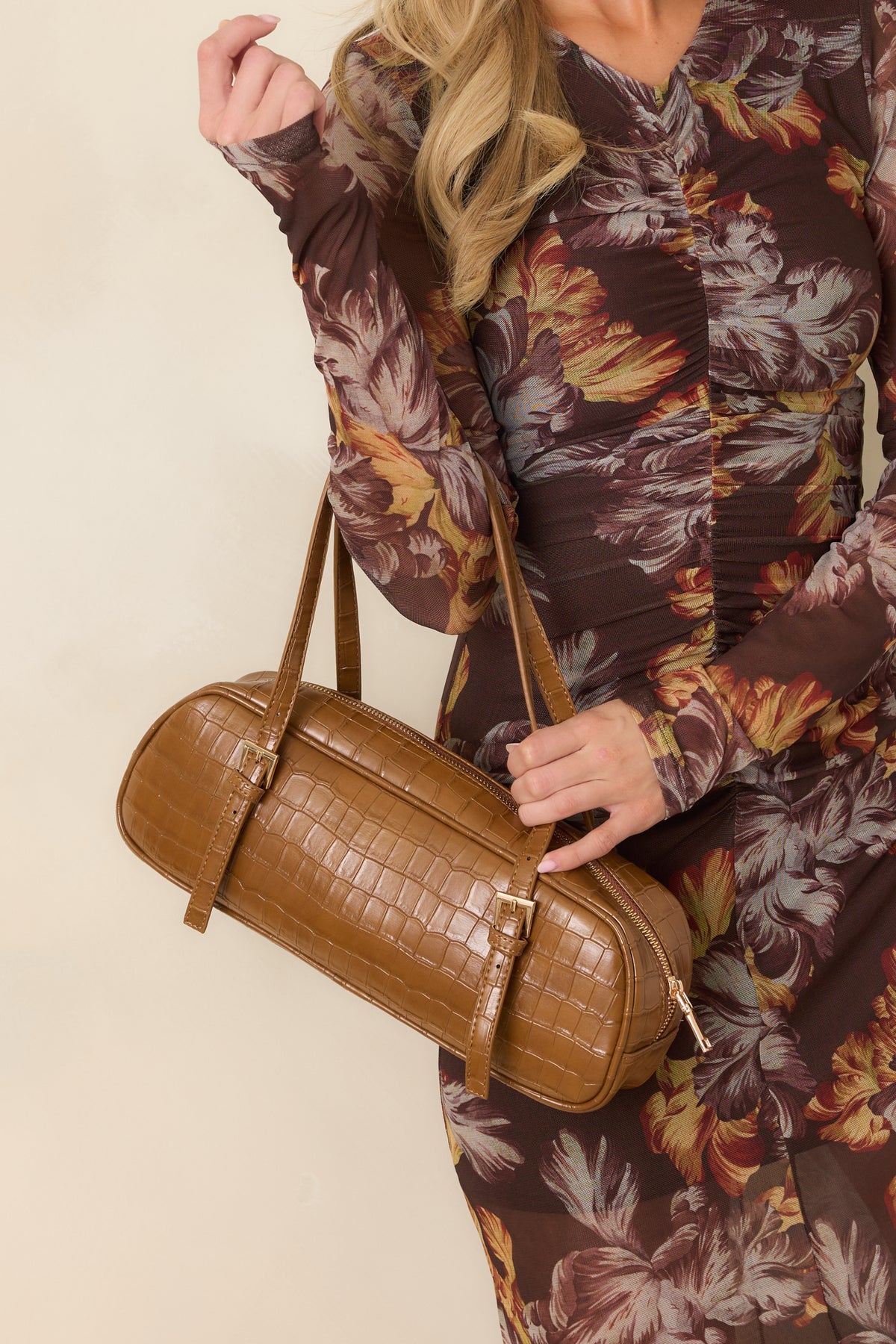 Brown croc-embossed faux leather handbag with structured top handles and an elongated silhouette.