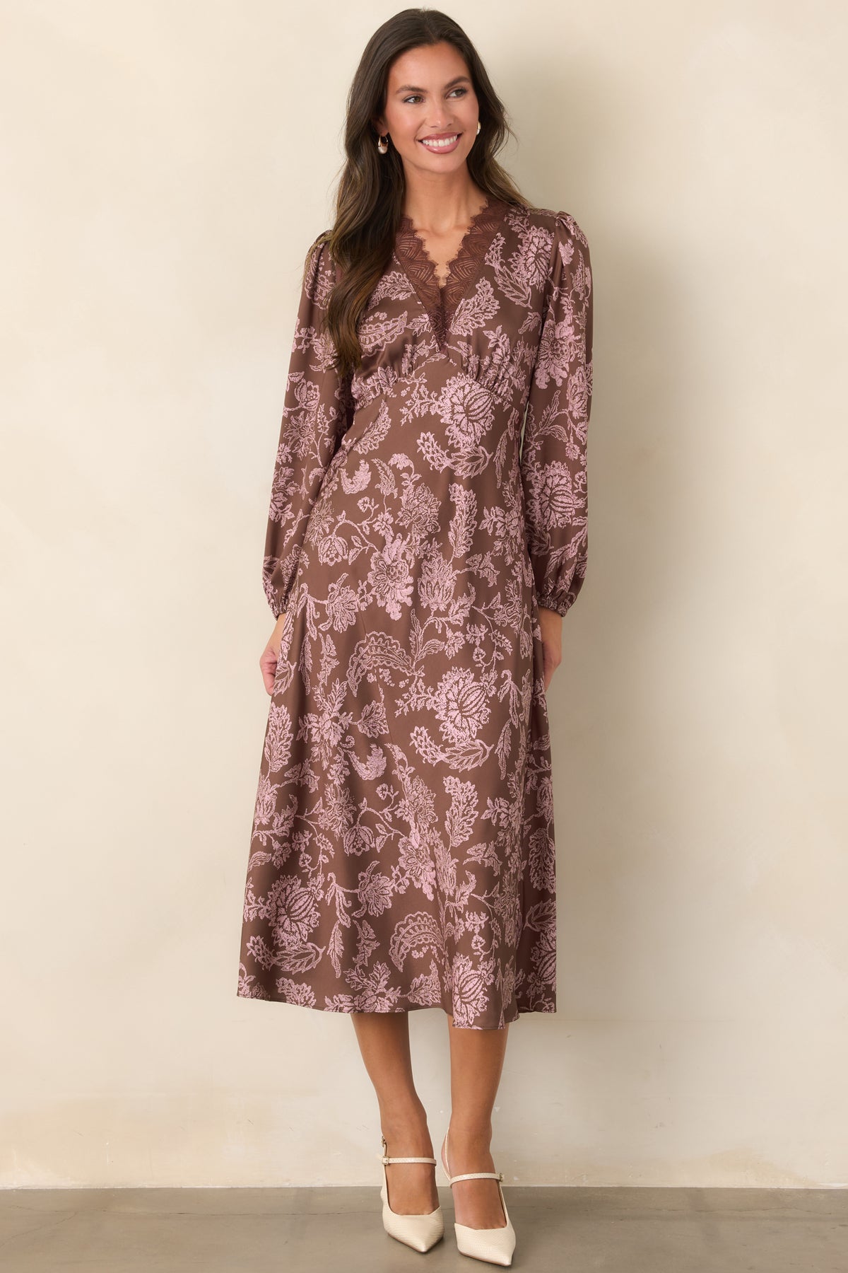 Brown floral midi dress with eyelash lace trim framing the V-neckline and a defined waist.