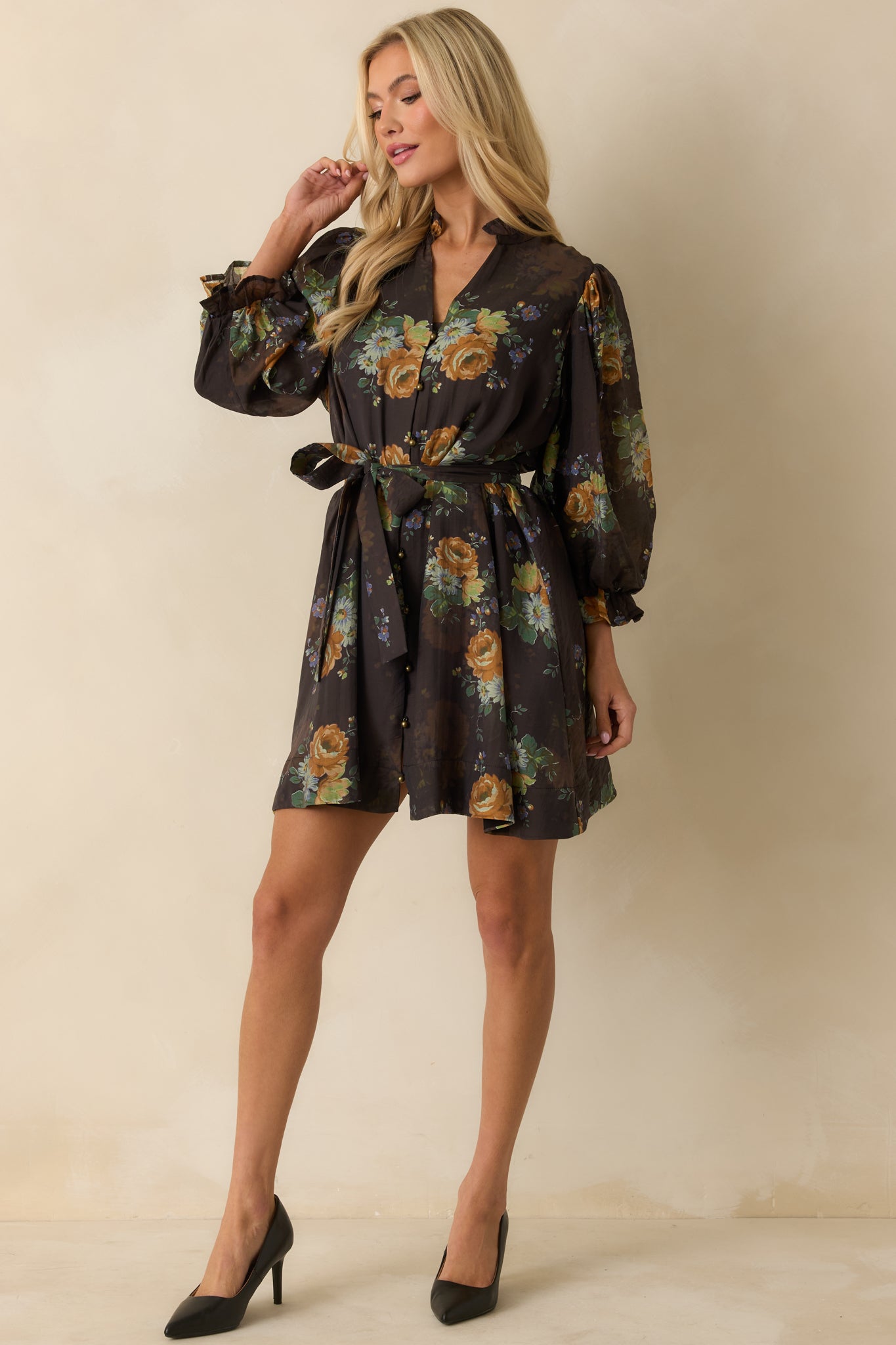 Brown floral print mini dress with button-down front, collared neckline, and adjustable waist tie for shape.