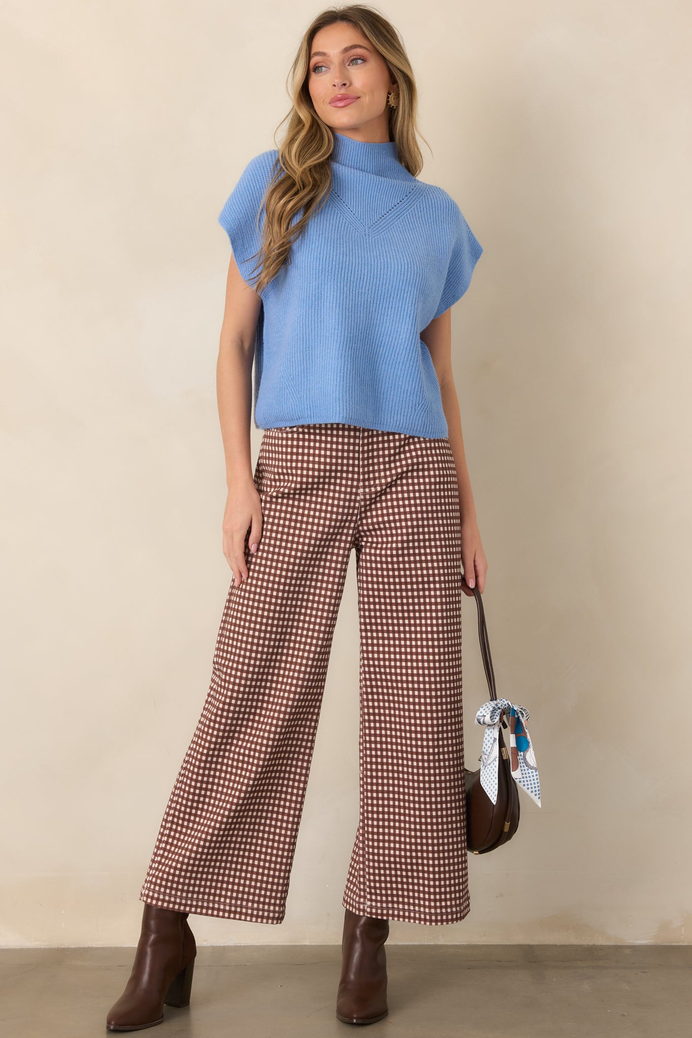 Stretch cotton-blend trousers showcasing an allover gingham pattern, flowing wide legs, functional front pockets, and a polished high waist.