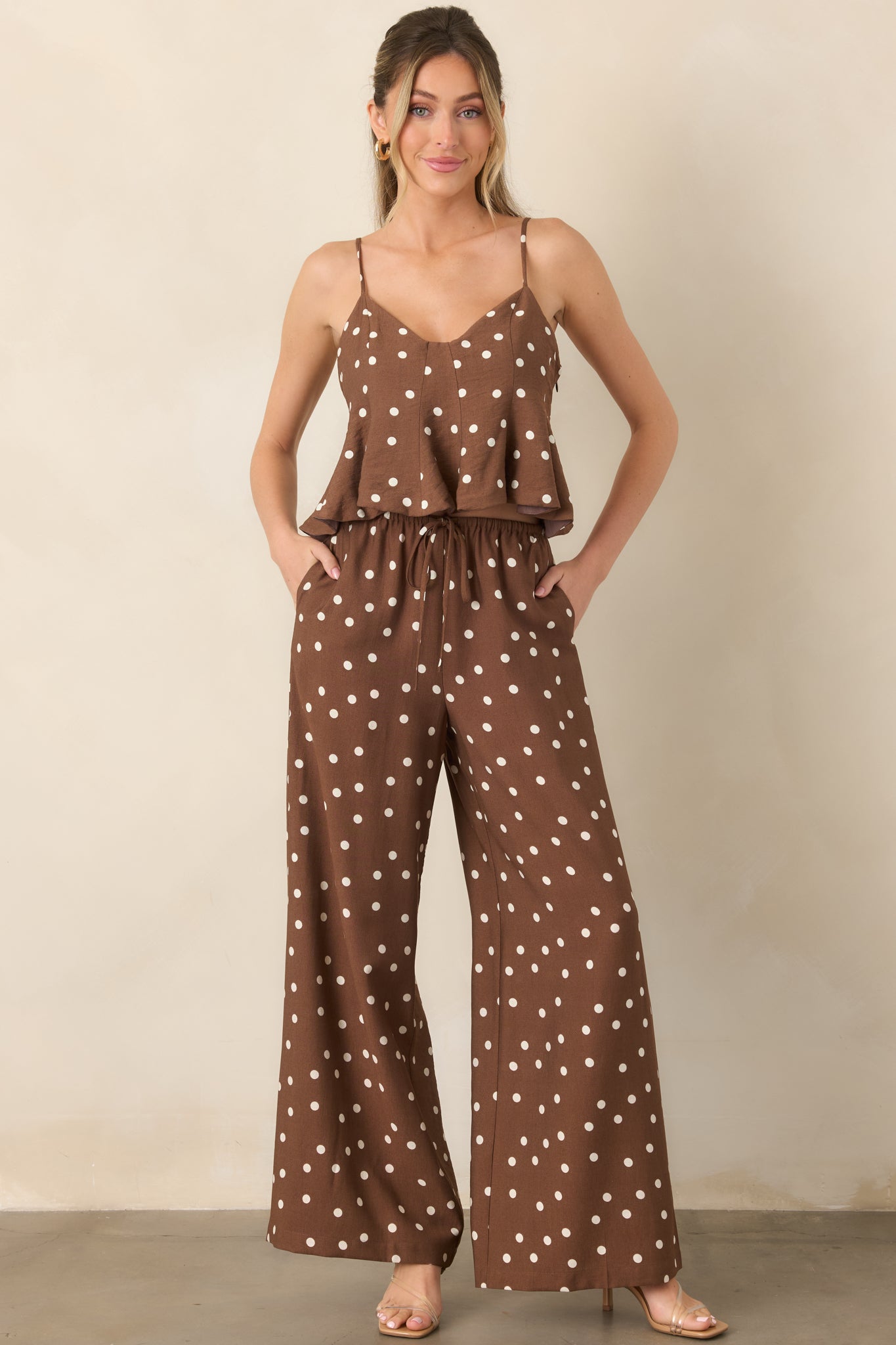 Flowing wide-leg pants with a playful brown and ivory polka dot pattern, adjustable drawstring waistband, and easy pull-on design.