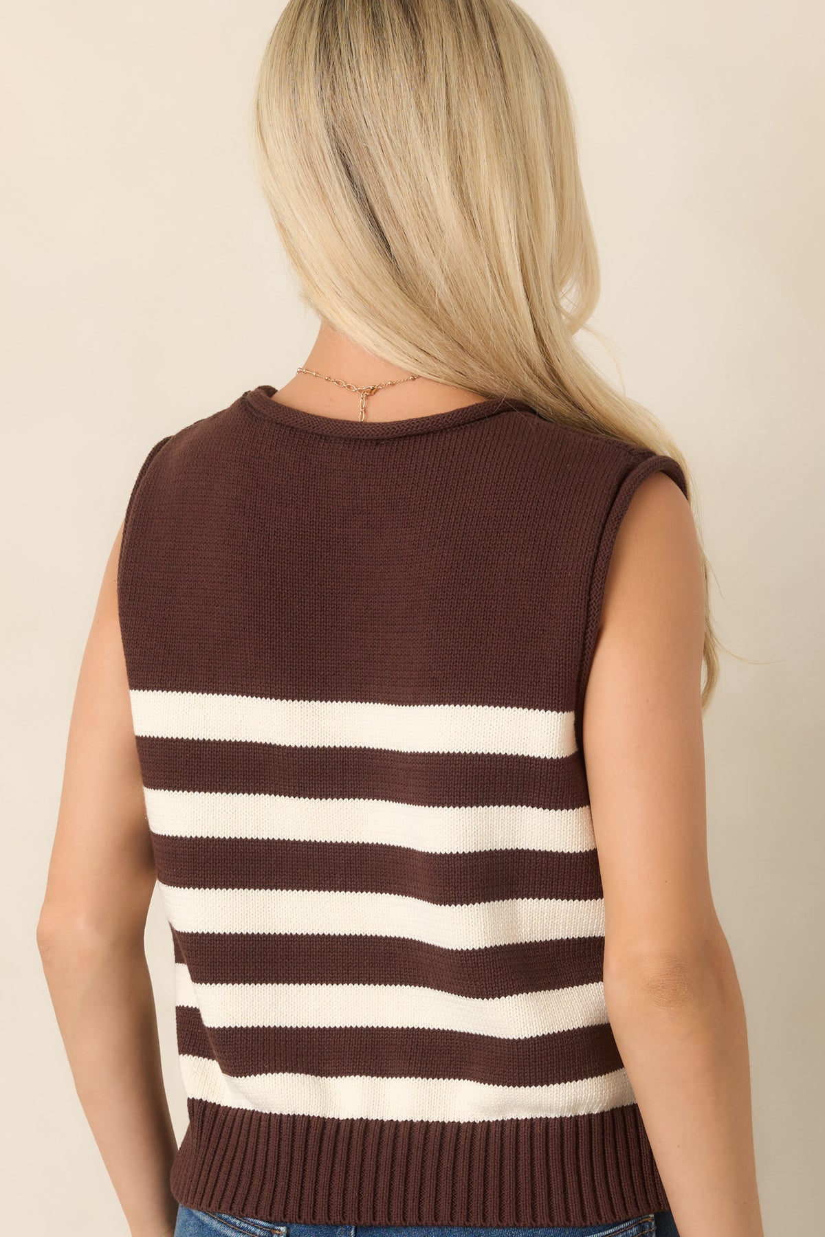 Rear view of the brown and ivory striped cotton top, showcasing its relaxed boxy silhouette, round neckline, and ribbed hem.