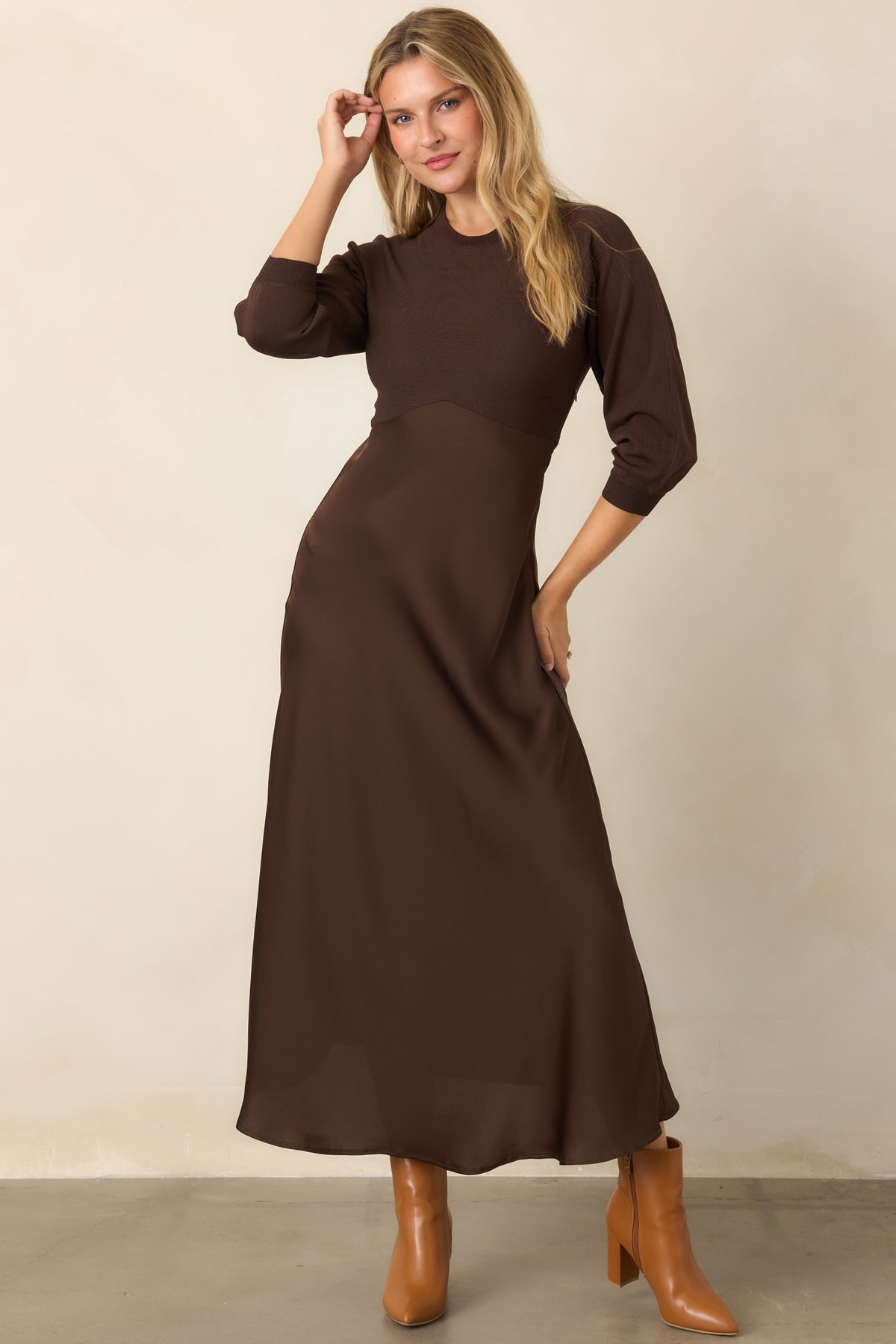 Brown coordinated midi dress with a fitted round-neck knit bodice and softly flowing high-waisted satin A-line skirt.