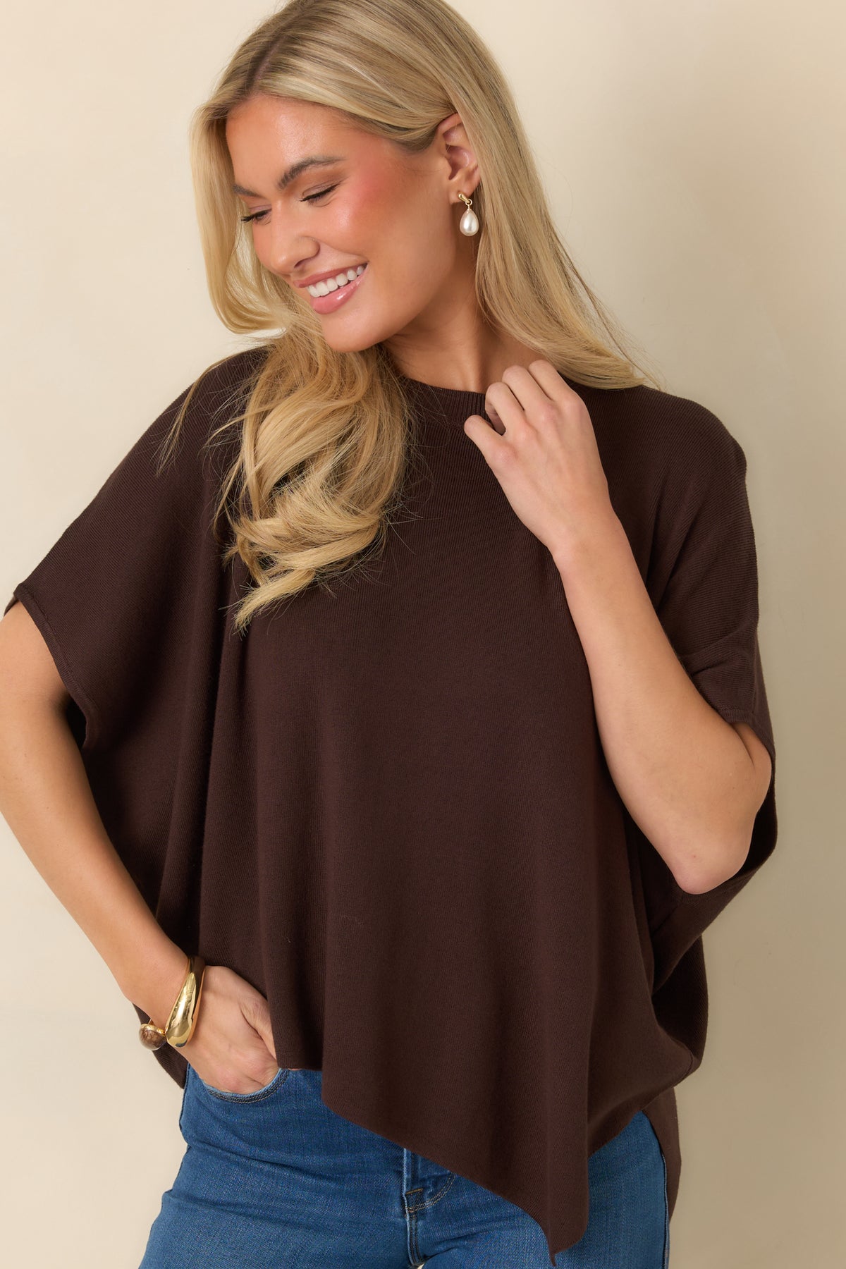Brown knit top with wide short sleeves and a relaxed fit through the upper portion.