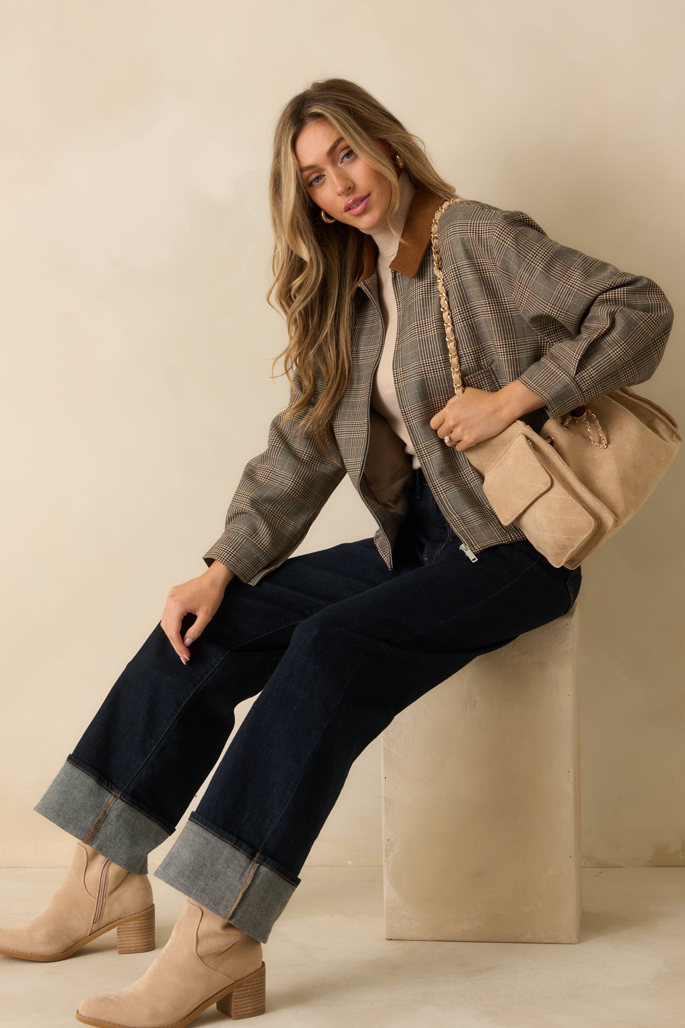 Brown multi plaid woven bomber jacket displayed front-facing, highlighting the corduroy collar, zip closure, and flap pockets.