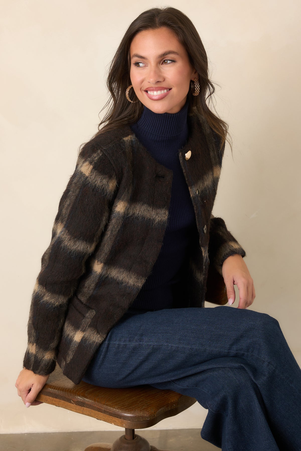 Brushed wool-blend plaid jacket showcasing a defined waist, front patch pockets, and a clean collarless neckline.