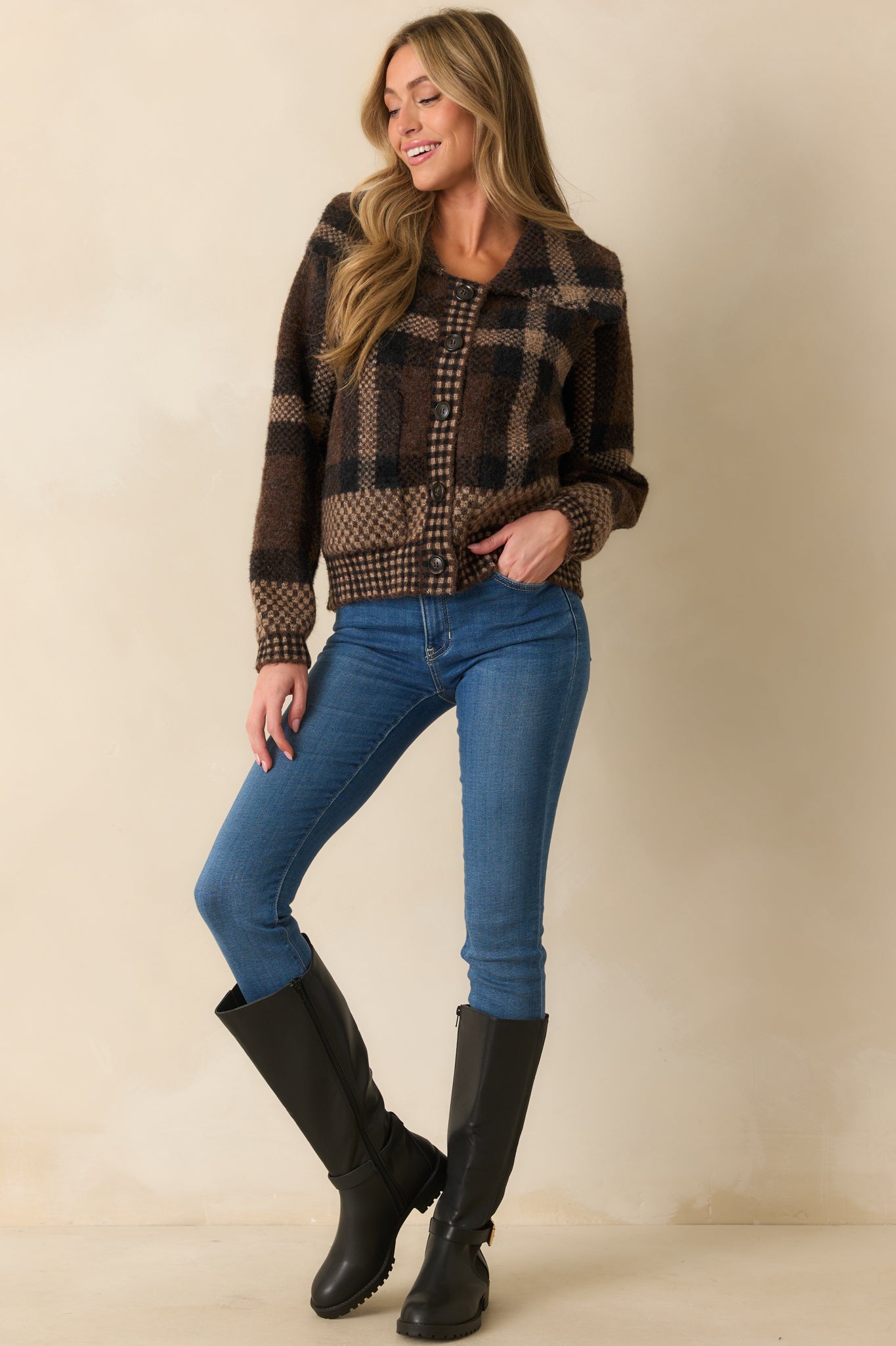Brown plaid cardigan with wide notched collar, long sleeves, full button front, and functional patch pockets.