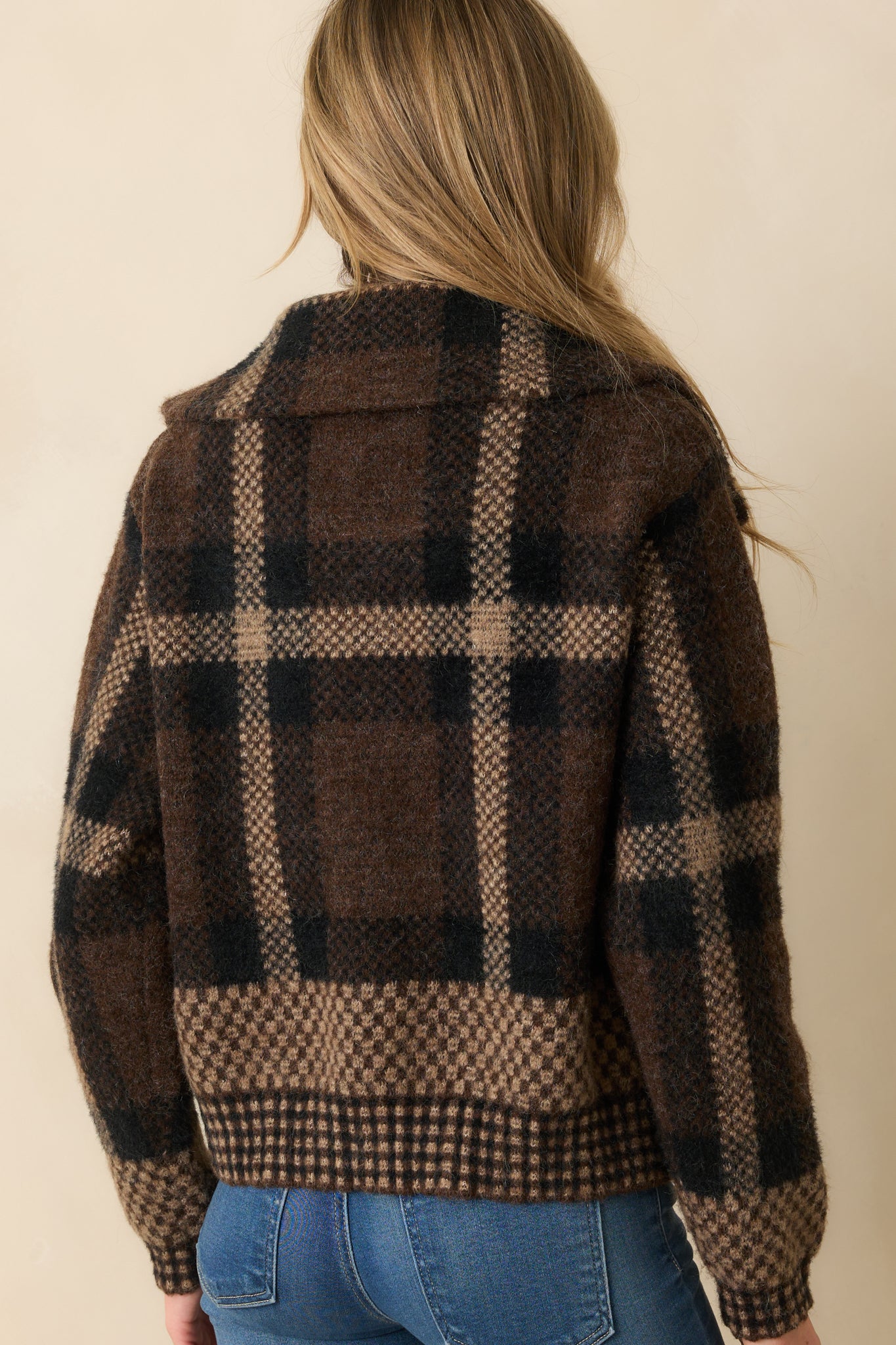 Rear view of brown multicolor plaid cardigan with long sleeves and clean straight hem.