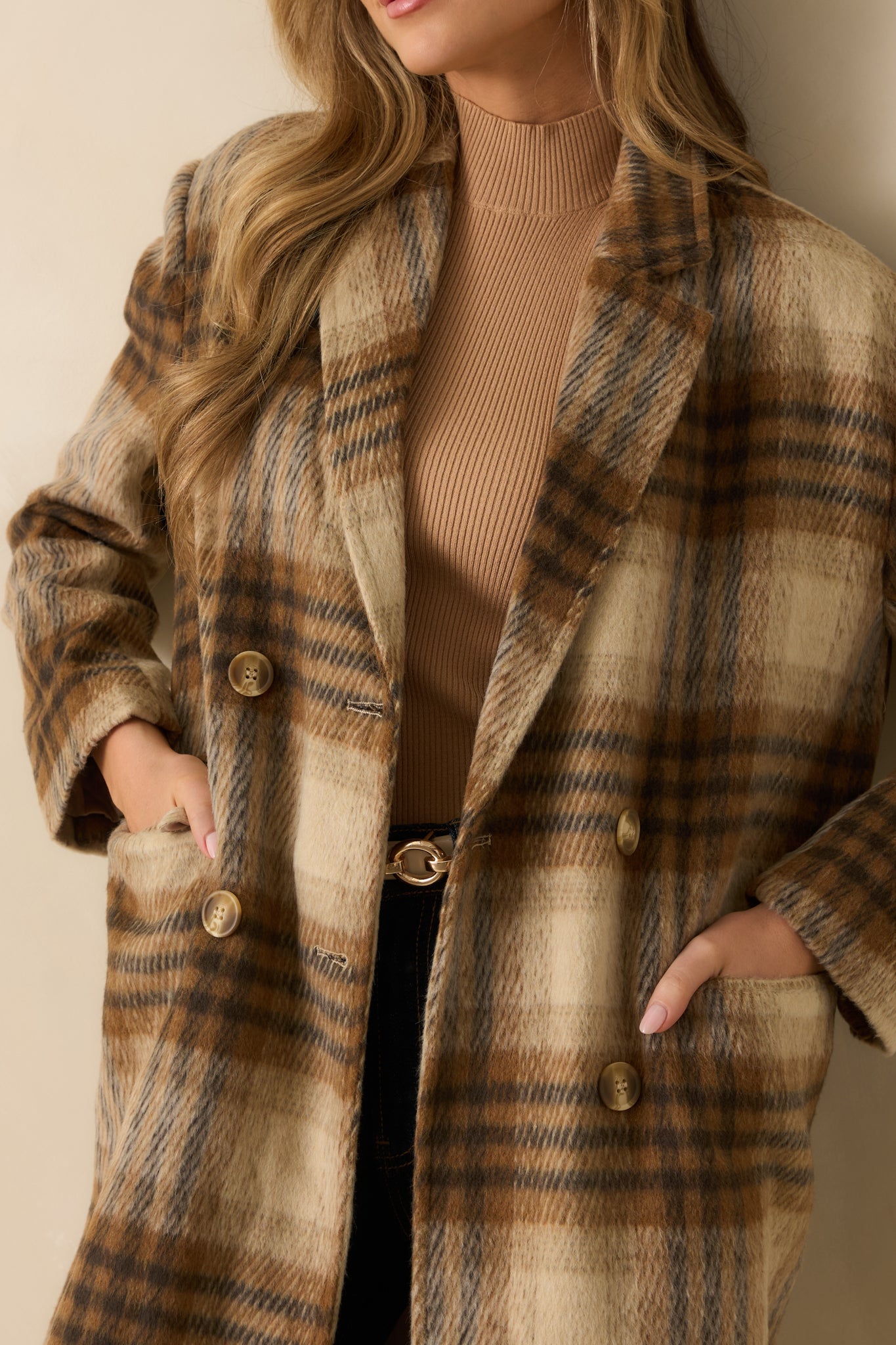 Close-up of the brown plaid fabric and soft wool-blend weave, emphasizing its cozy texture and fine finish.