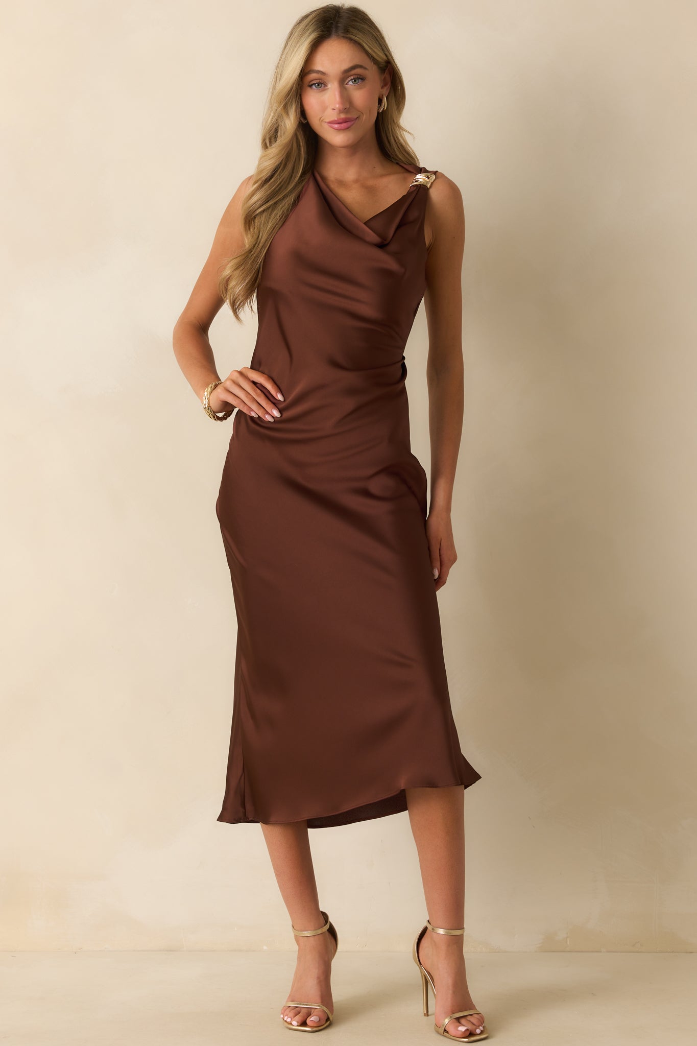 Brown satin dress showcasing the sleeveless cut and side-concealed zipper.