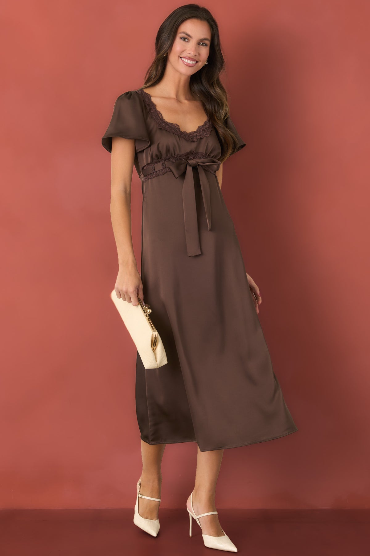 Brown satin midi dress featuring tonal scalloped lace along the scoop neckline and empire waist.